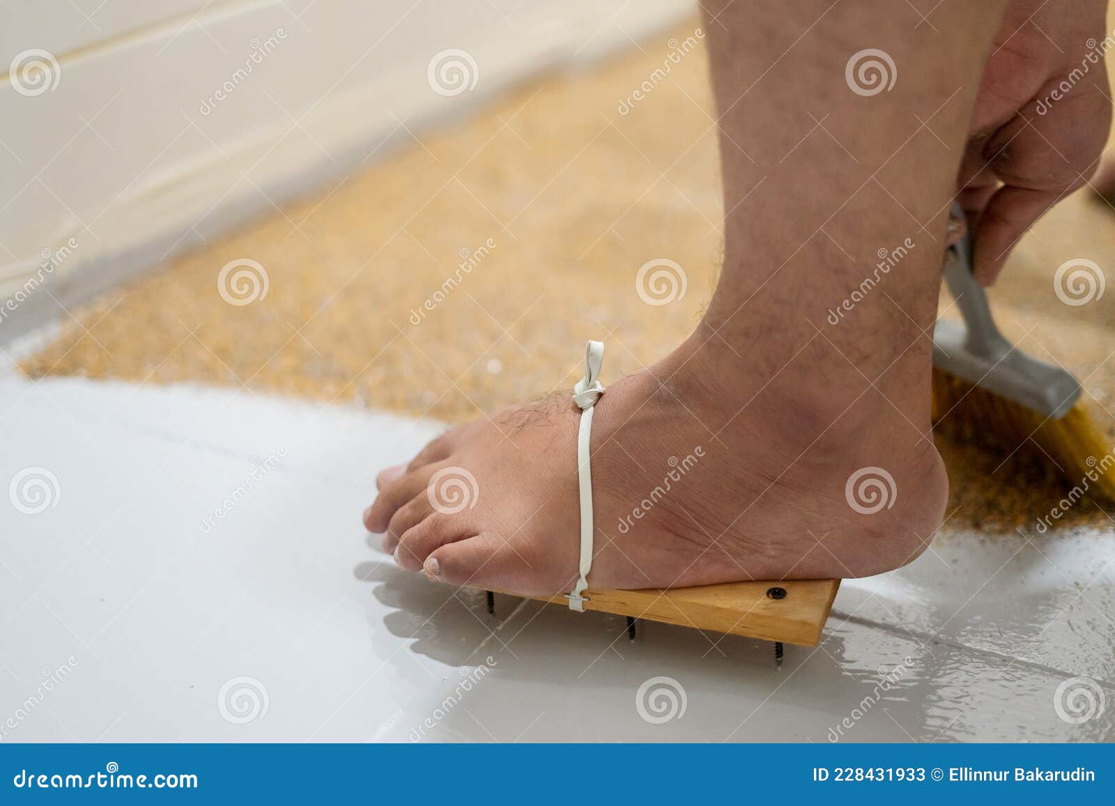 Feet Wearing Painters' Wooden Shoes Nails Self Leveling Epoxy