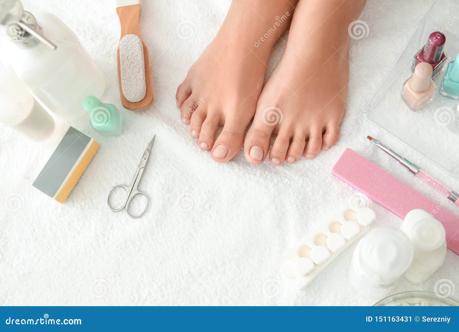 Feet of Young Woman and Set for Pedicure on White Towel Stock Image ...