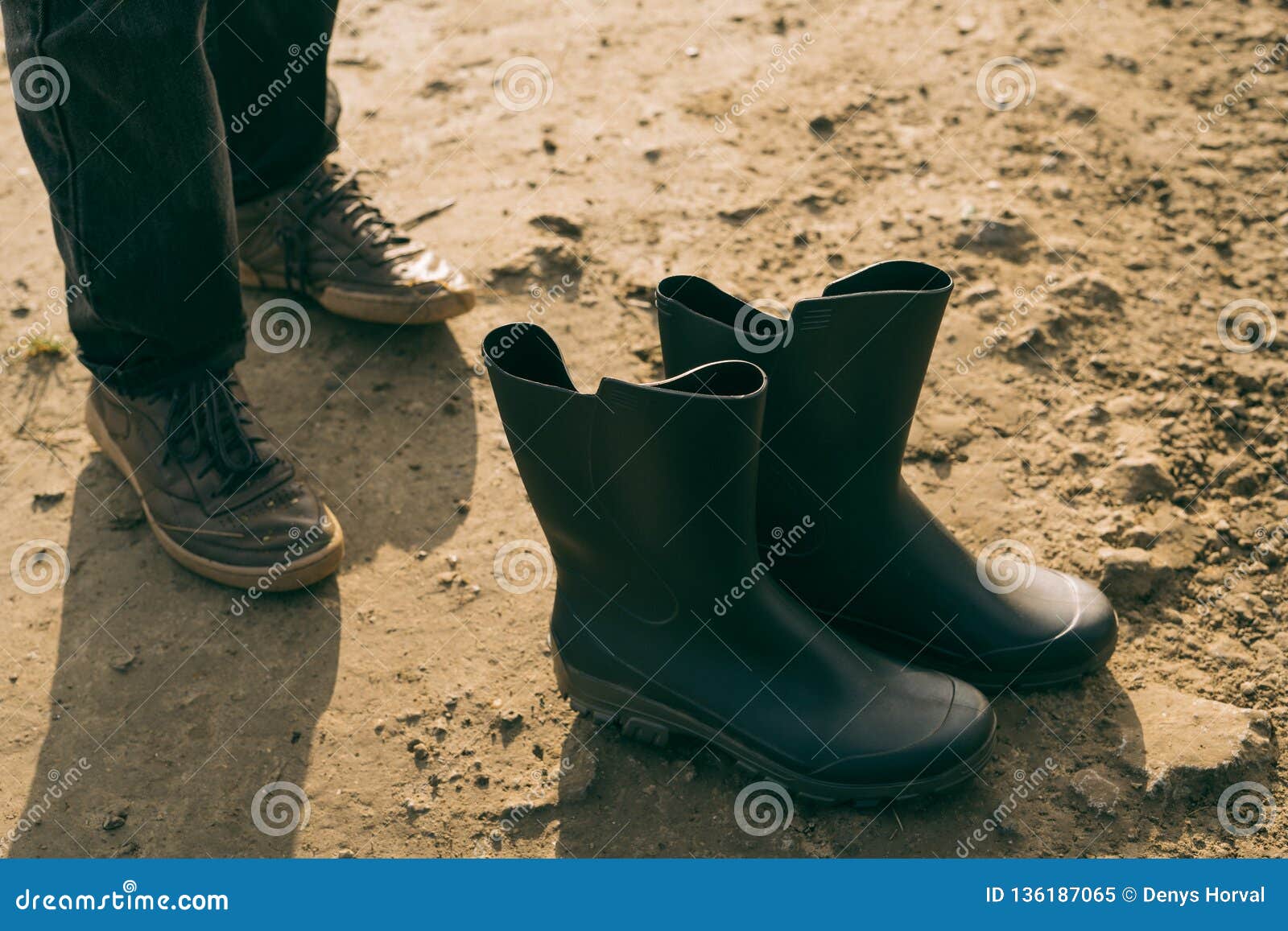 Feets and Clean Boots at Muddy Ground Stock Image - Image of boot, pair ...