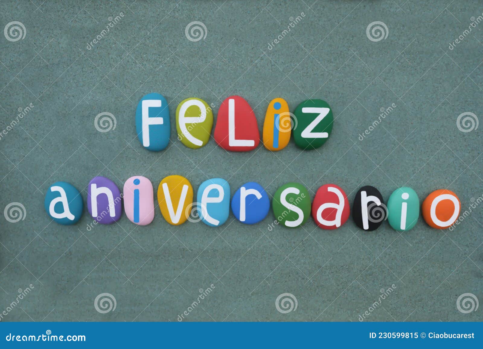 feliz aniversario, spanish and portuguese happy birthday text composed with colored stone letters