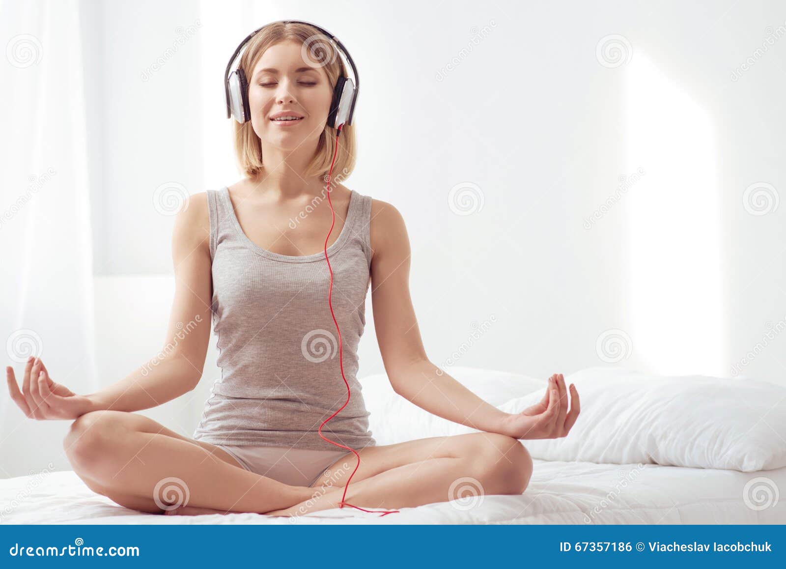 Smiling women training yoga positions in modern - Stock Photo  [100665919] - PIXTA