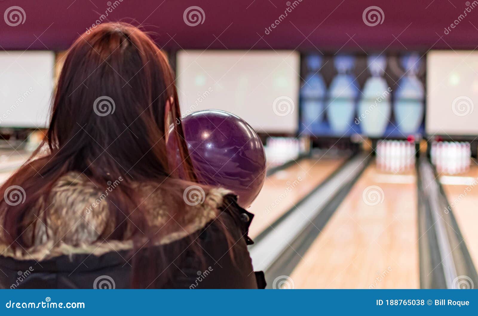 Female while Aiming Towards Pins in a Bowling Game. Competitive Bowling