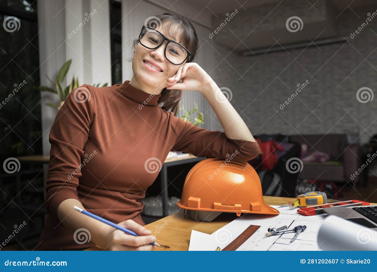 Female Architect Working with New Startup Project at Home Office Stock