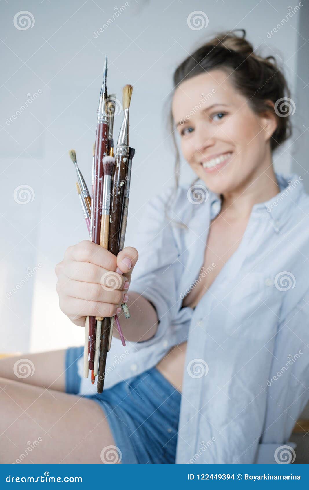 Female Artist Hand Painter with Brushes in Front of the Canvas a Stock