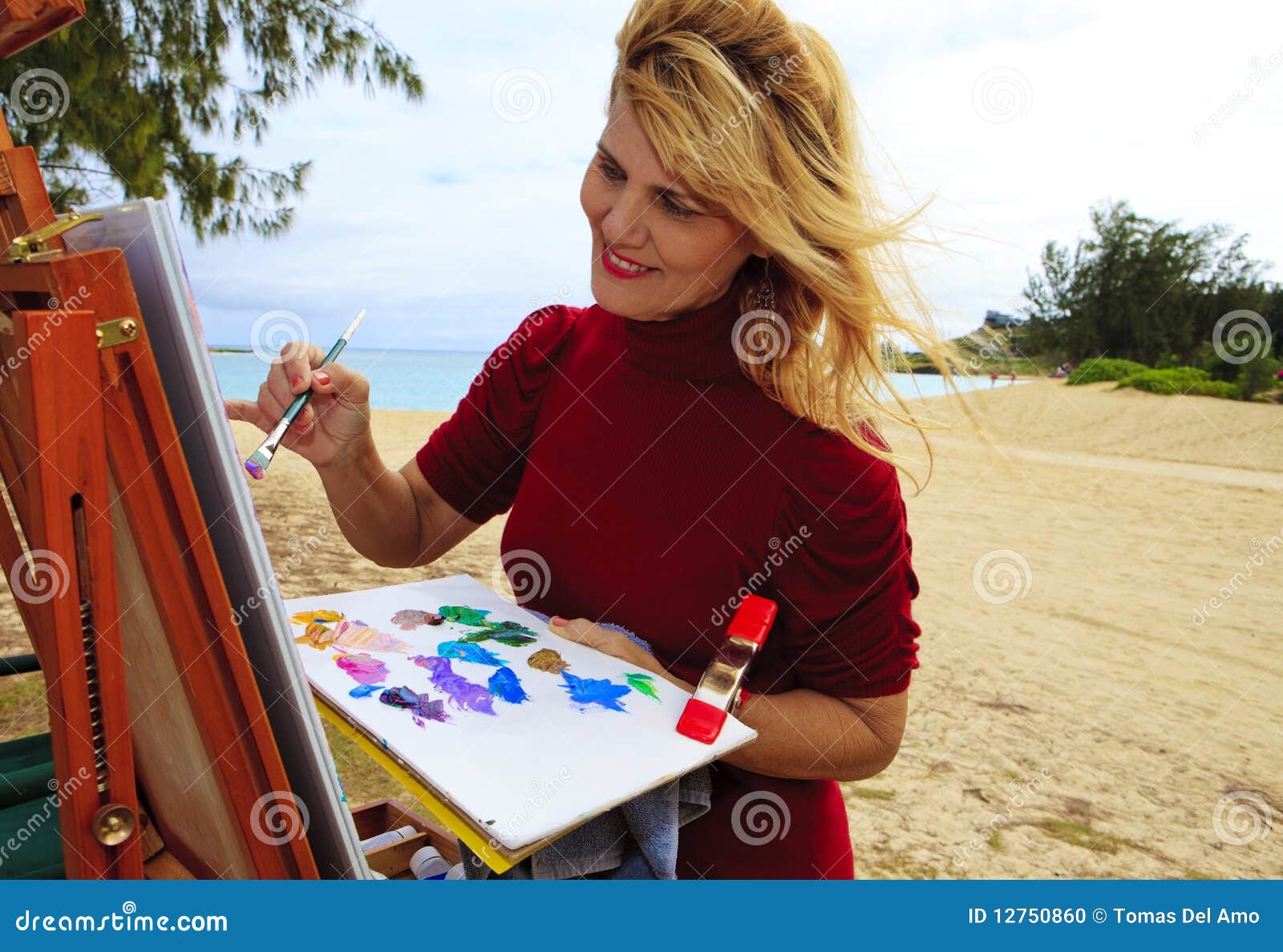 female artist painting outdoors