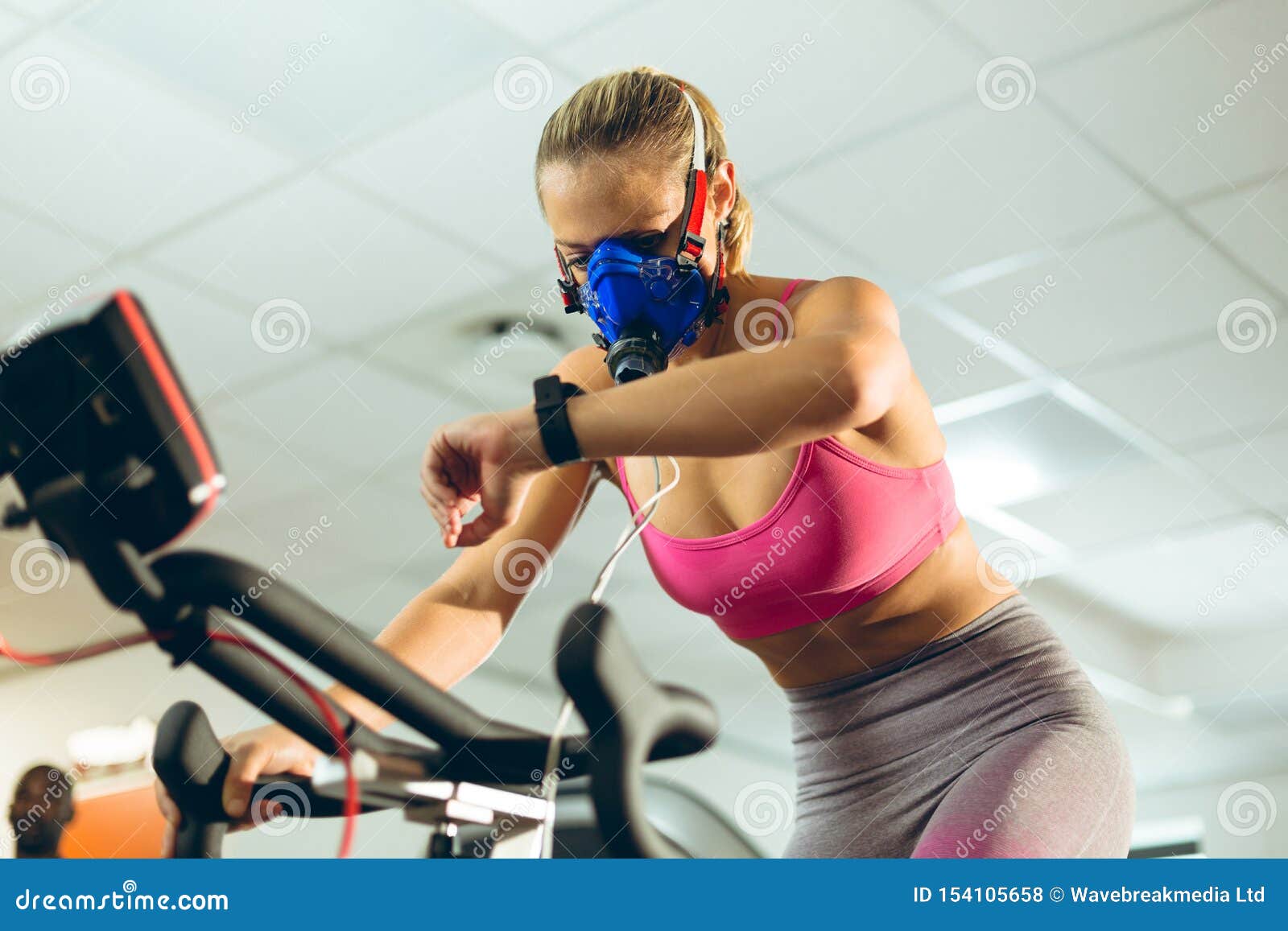 Athlete with Oxygen Mask Checking Time while Exercising with Bike in Fitness Studio Stock Photo Image of active, healthy: 154105658