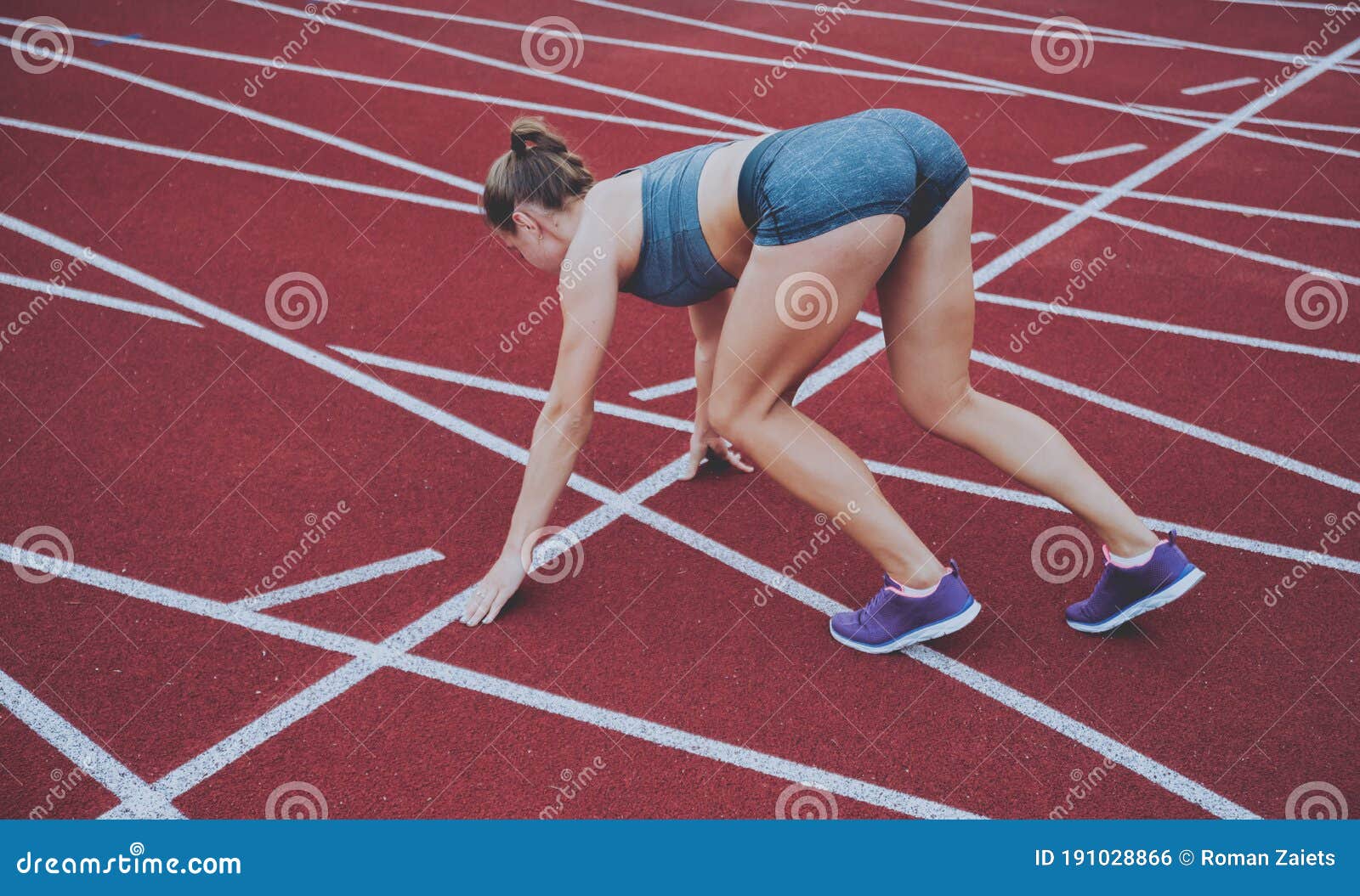 Female runner legs start to run on road. Closeup of woman 