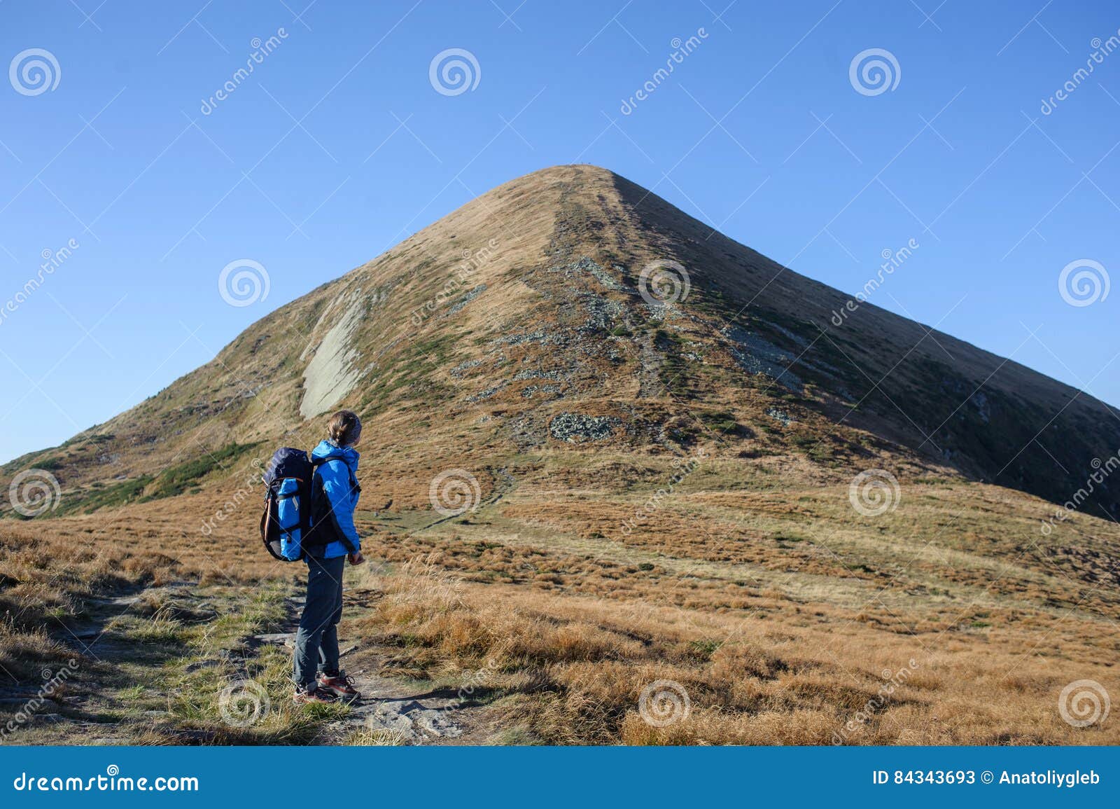 female backpaker in the carpathians mountains with backpack