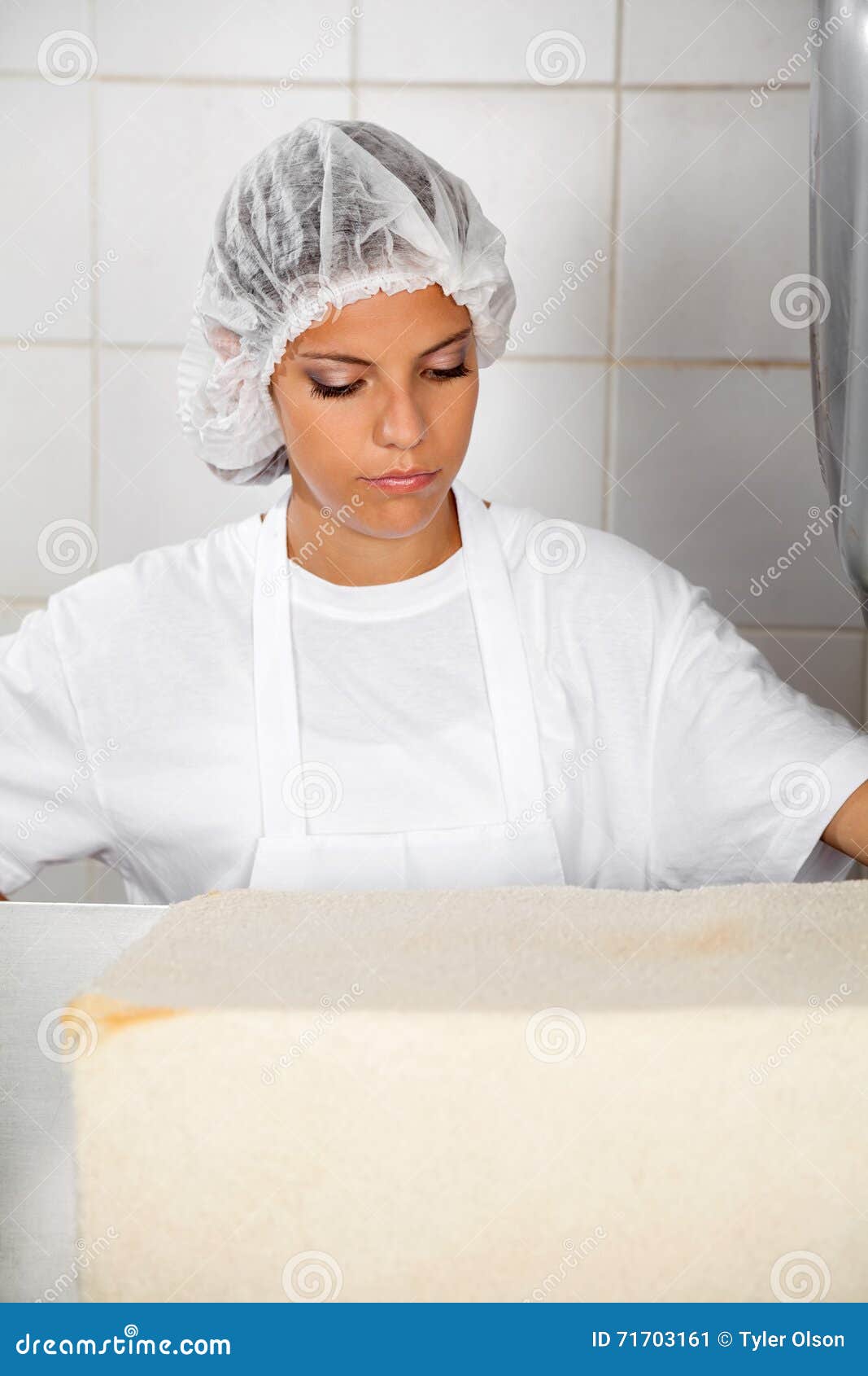 Female Baker Looking at Fresh Bread Stock Image Image of female