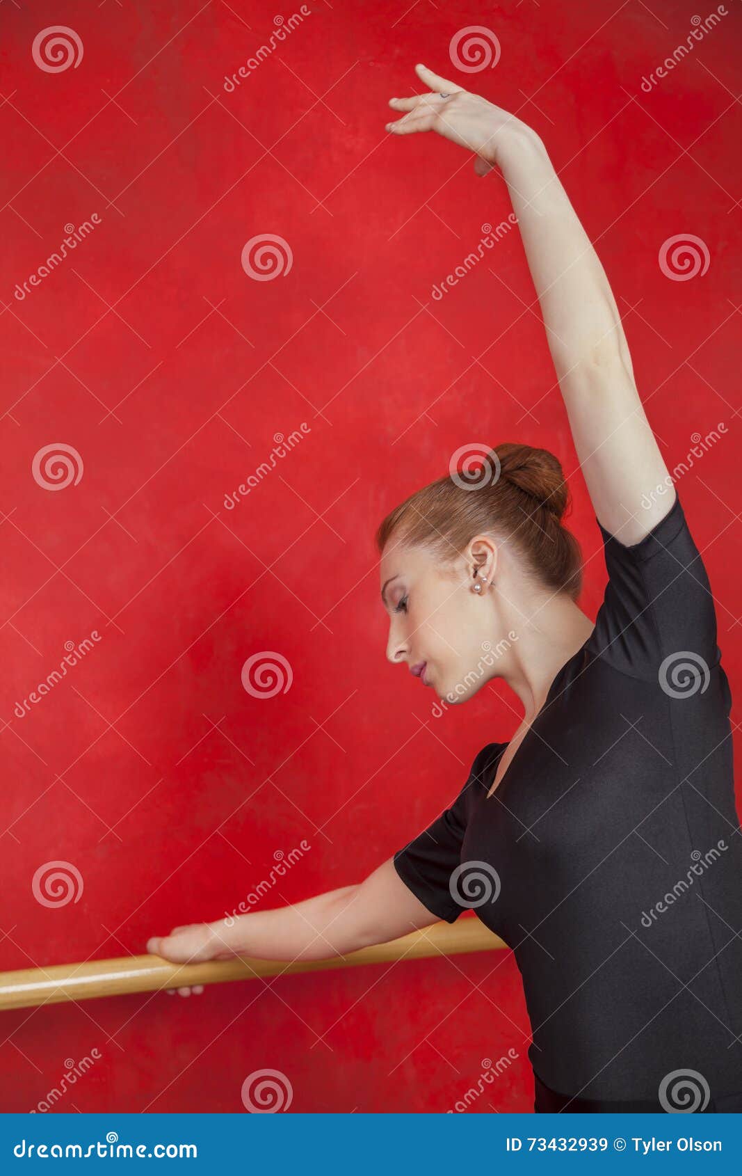 Download Female Ballet Dancer With Hand Raised At Barre Stock Image ...