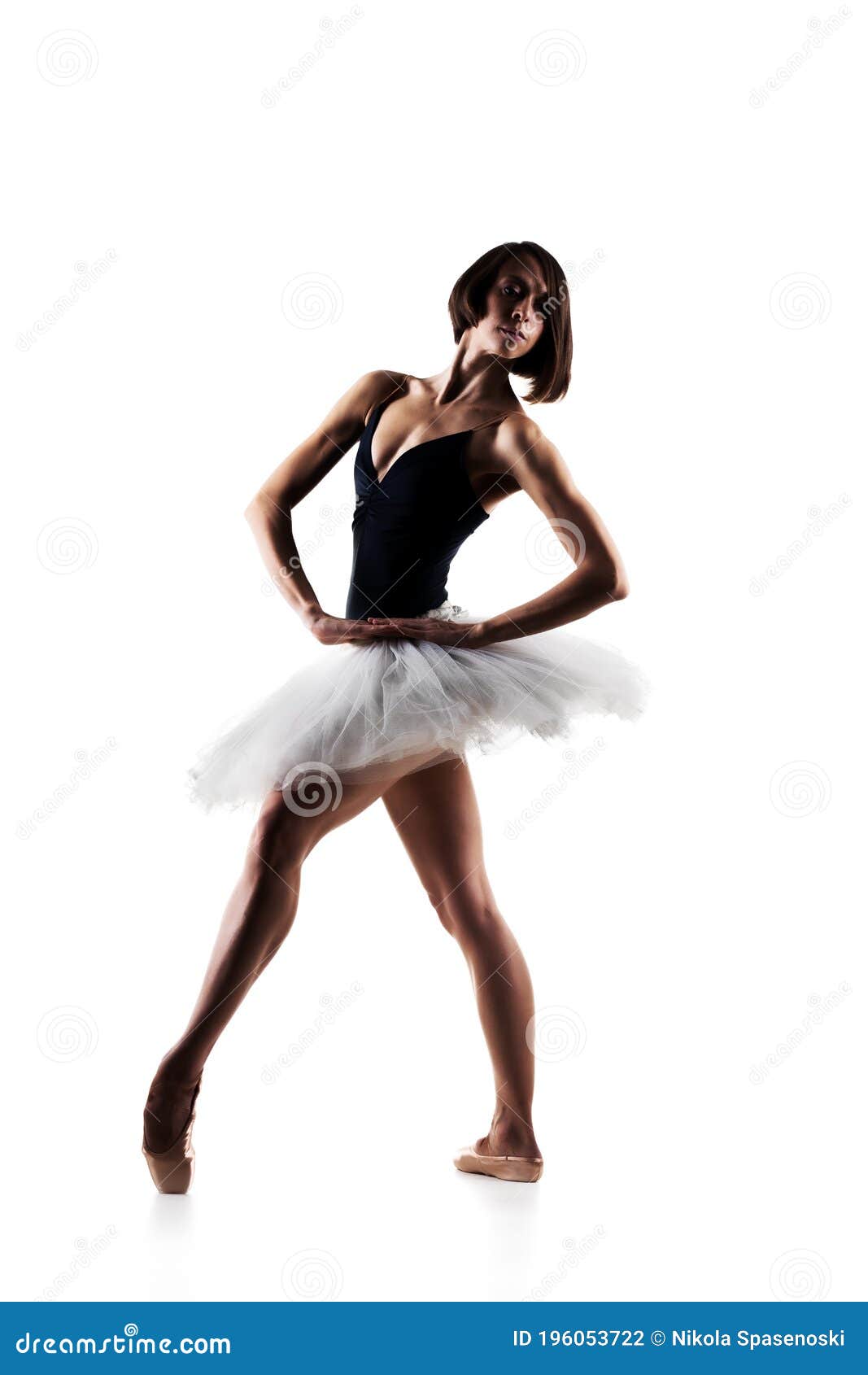 female ballet dancer wearing tutu. prima ballerina posing on white background