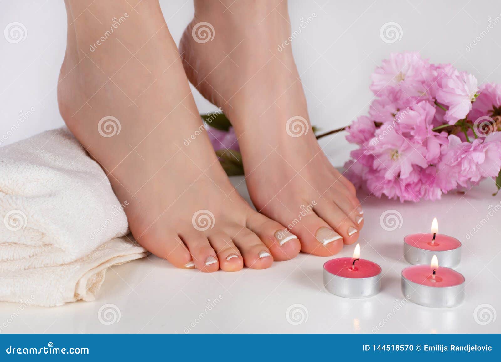 Beautiful Bare Feet Porn - Female Bare Feet with French Nails Polish on White Towel and Decorative  Candle Burning on Table and Pink Flower. Feet Fetish Stock Photo - Image of  female, beauty: 144518570