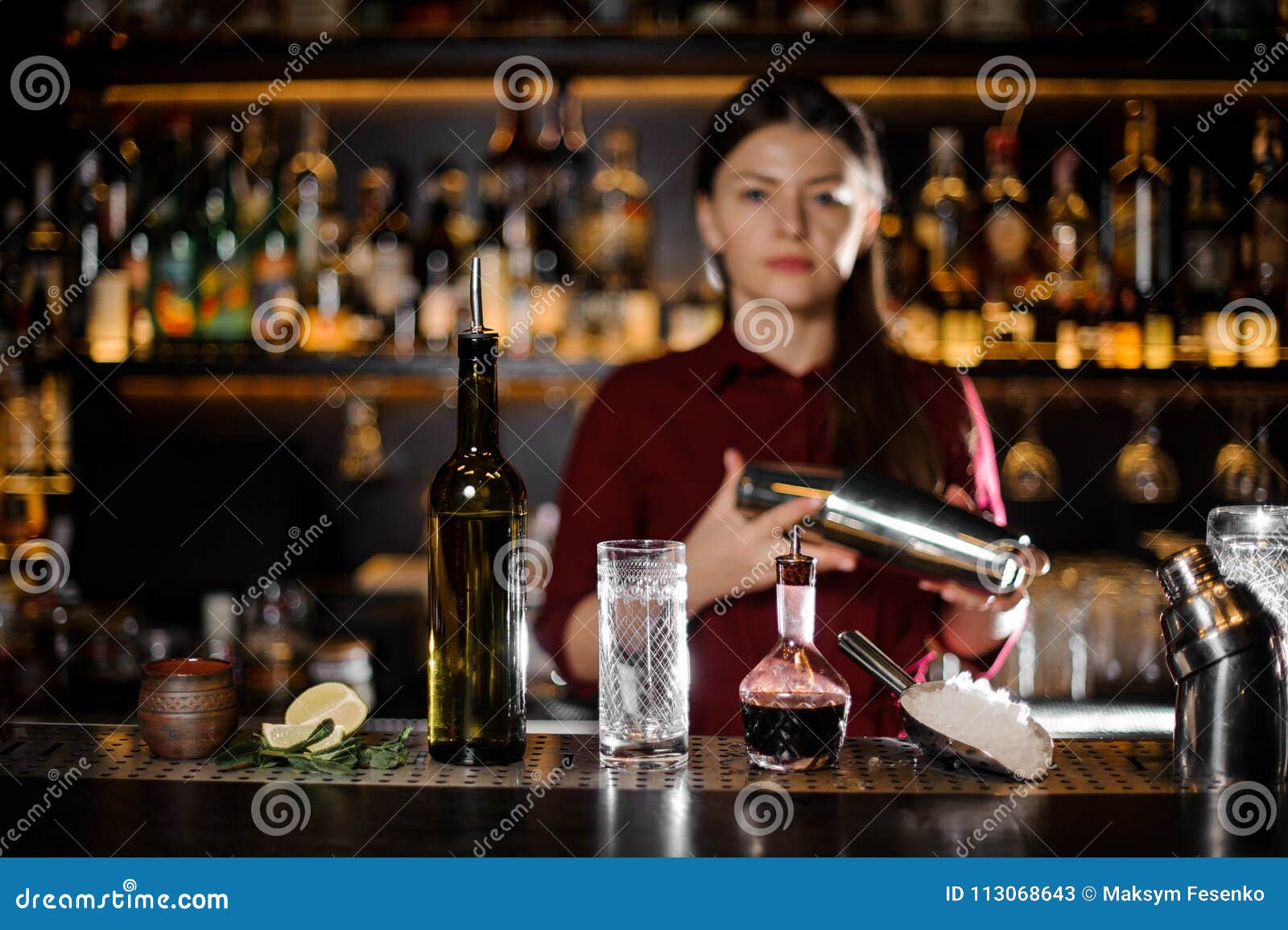 Female Bartender Shaking the Cocktail on the Bar Counter Stock Image ...