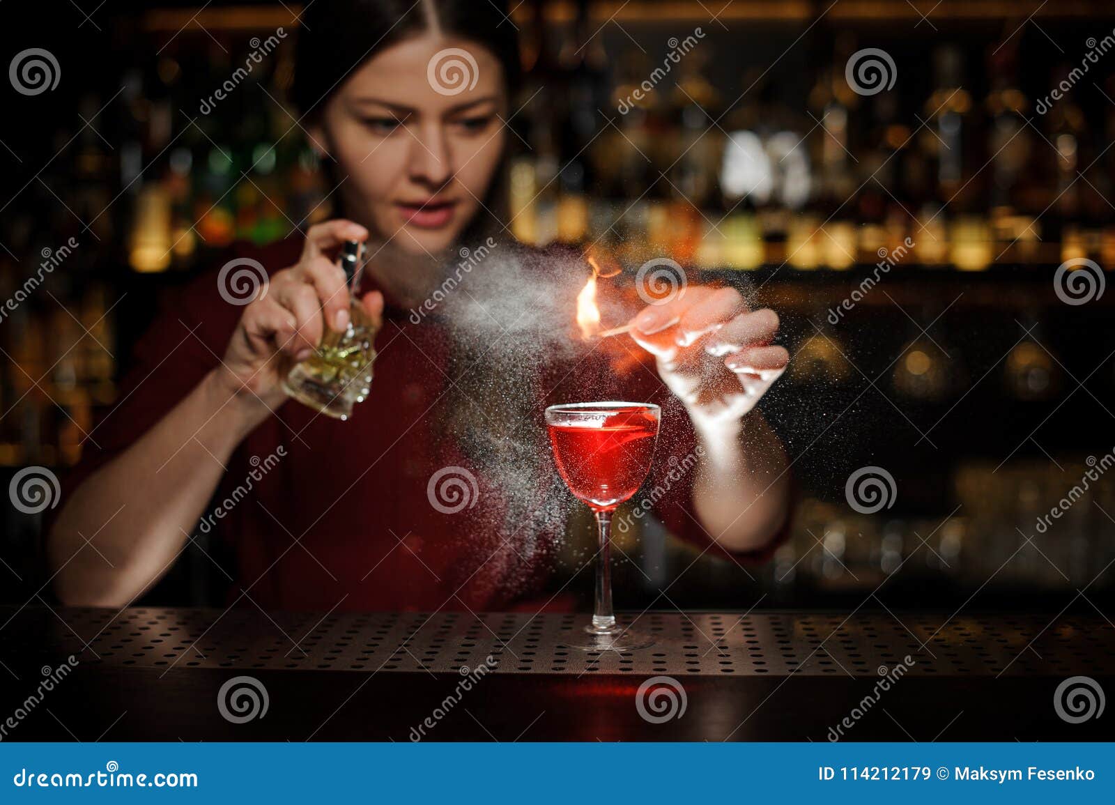 Female Bartender Spraying on the Fire Match Above the Cocktail Stock ...