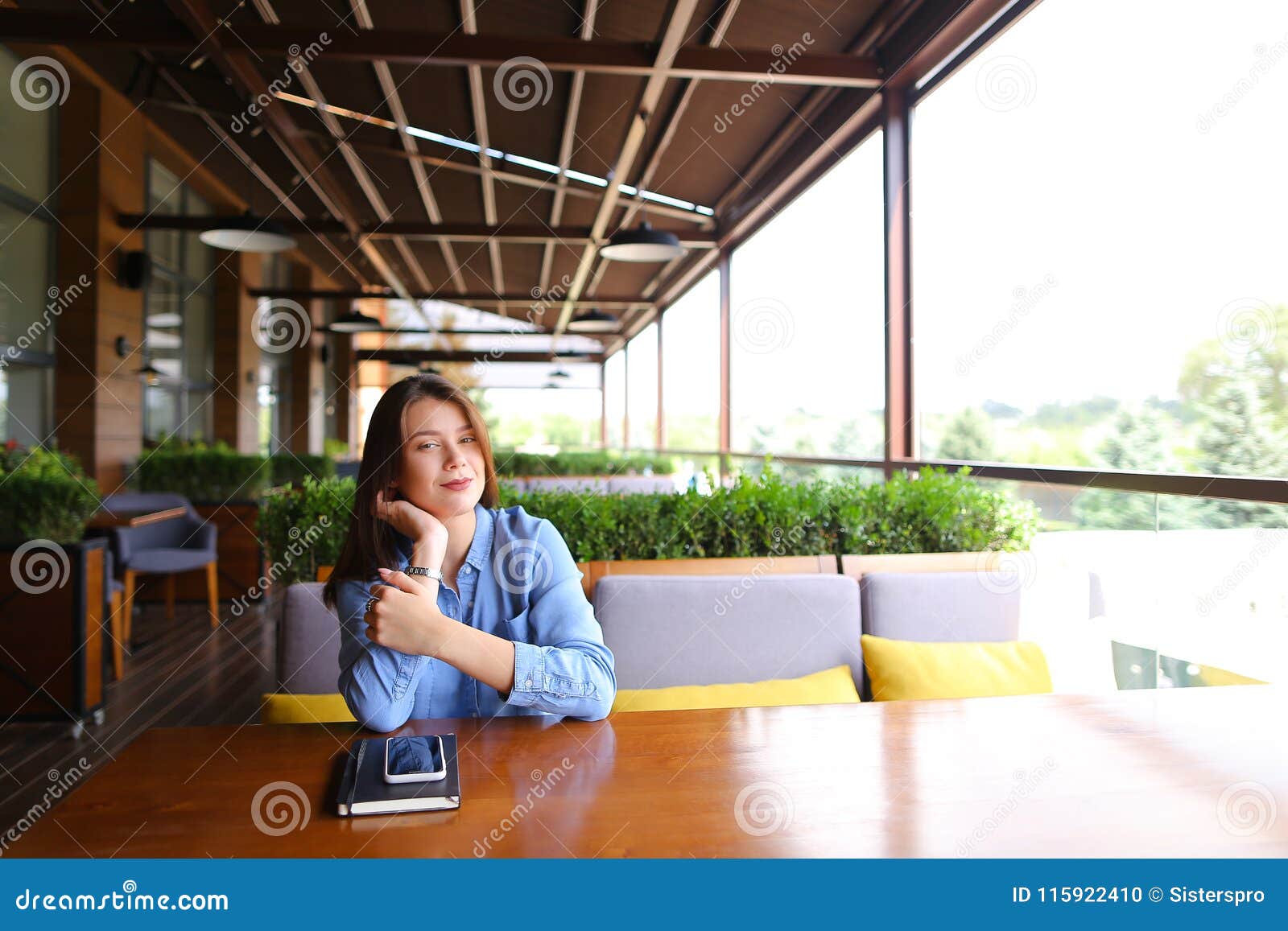 Female Beautiful Student Sitting at Cafe with Smartphone and Notebook ...