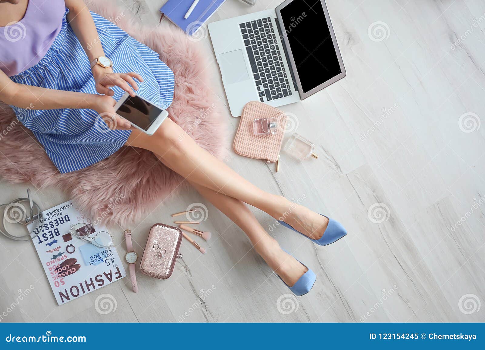 female beauty blogger with smartphone indoors