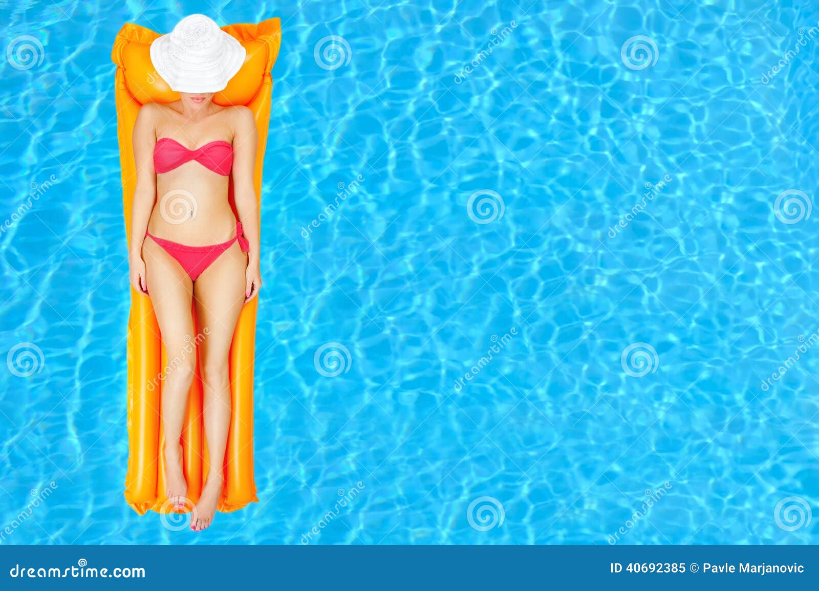 Female beauty relaxing in swimming pool