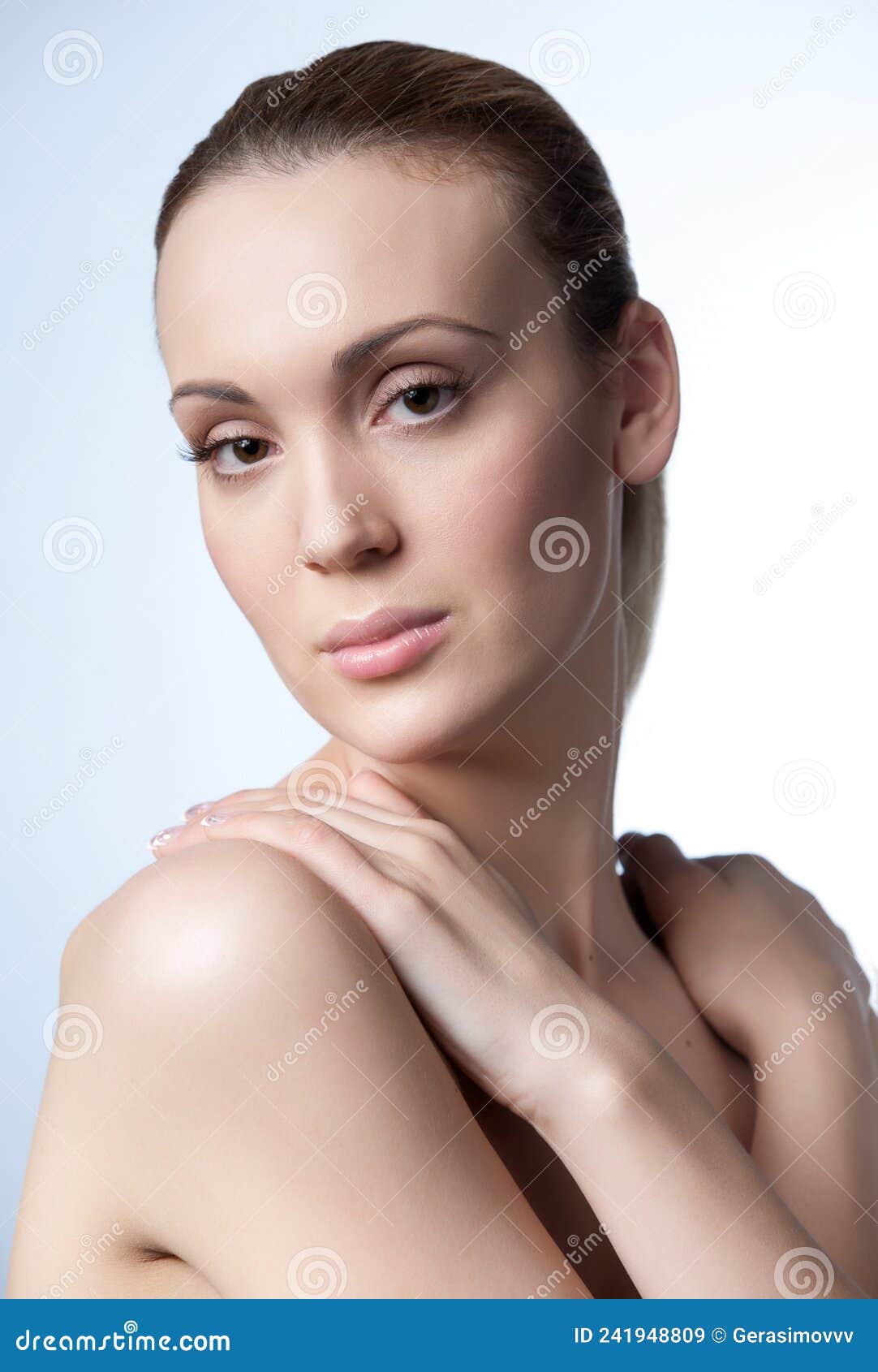 Female Beauty Vertical Portrait Shot With Nude Makeup On A White