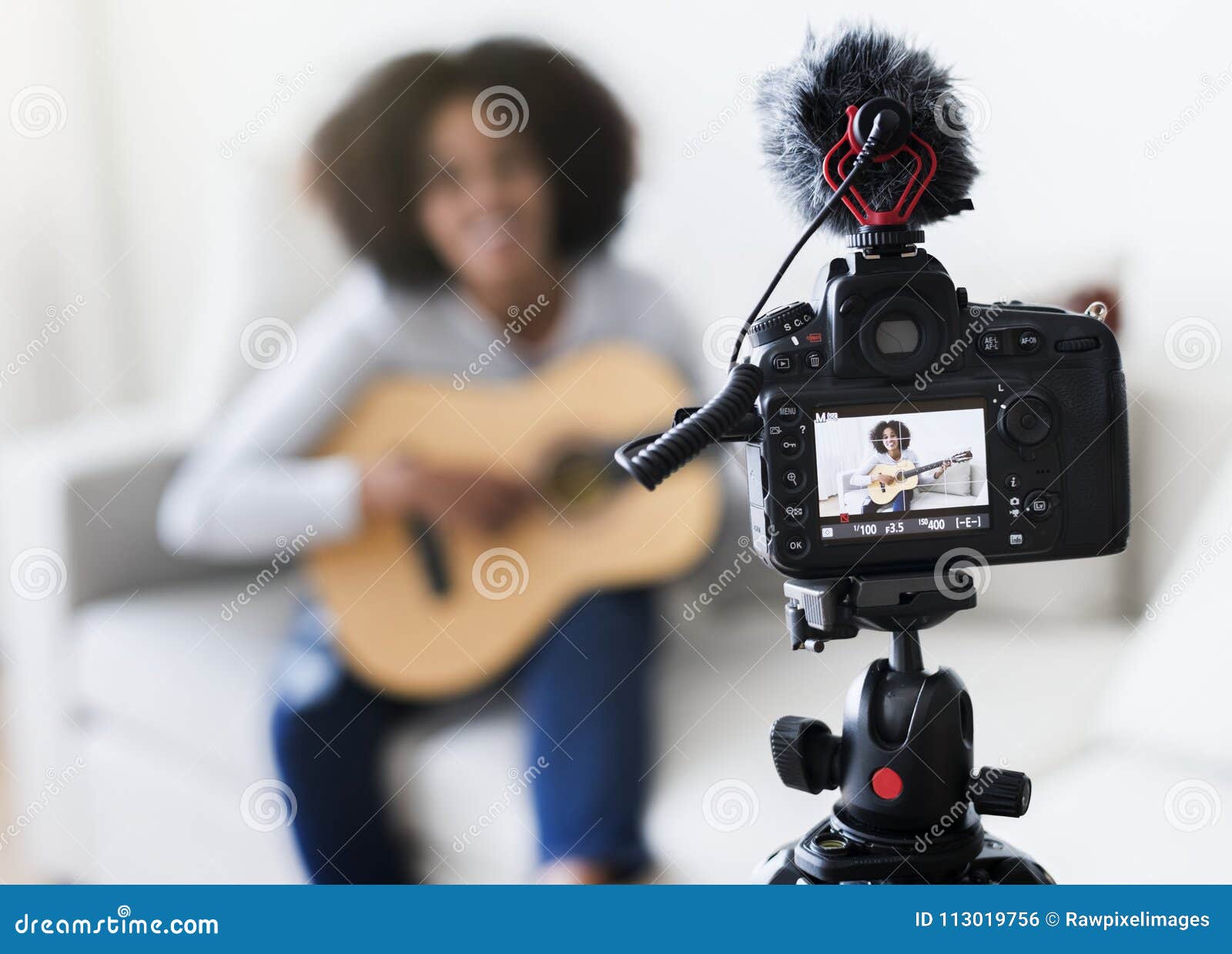 female blogger recording music related broadcast at home