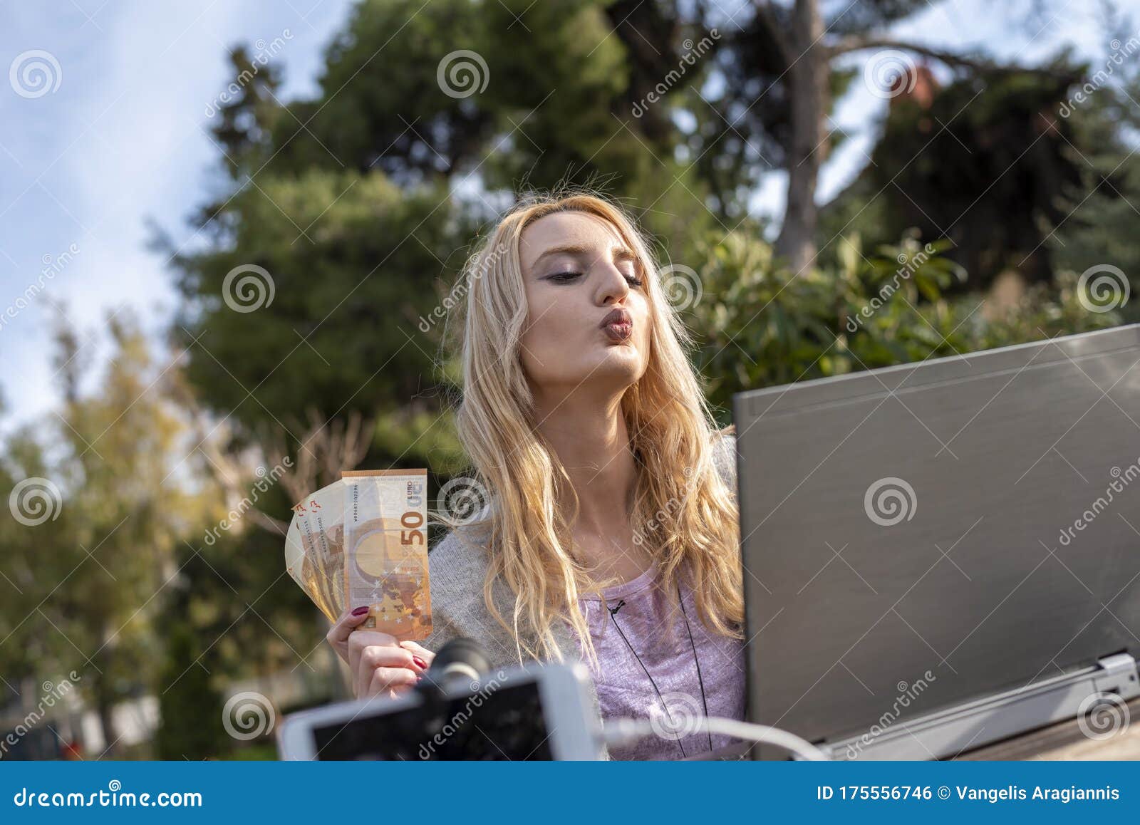 female blond blogger demonstrates money earned