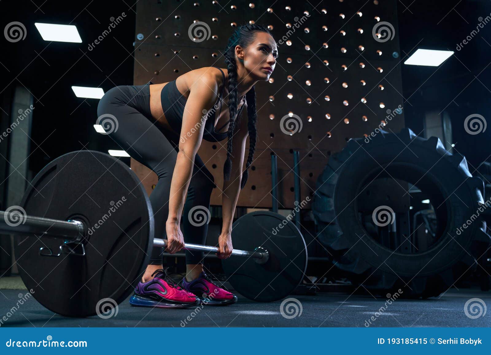 Female Bodubuilder Doing Deadlift Using Barbell in Gym. Stock Image ...