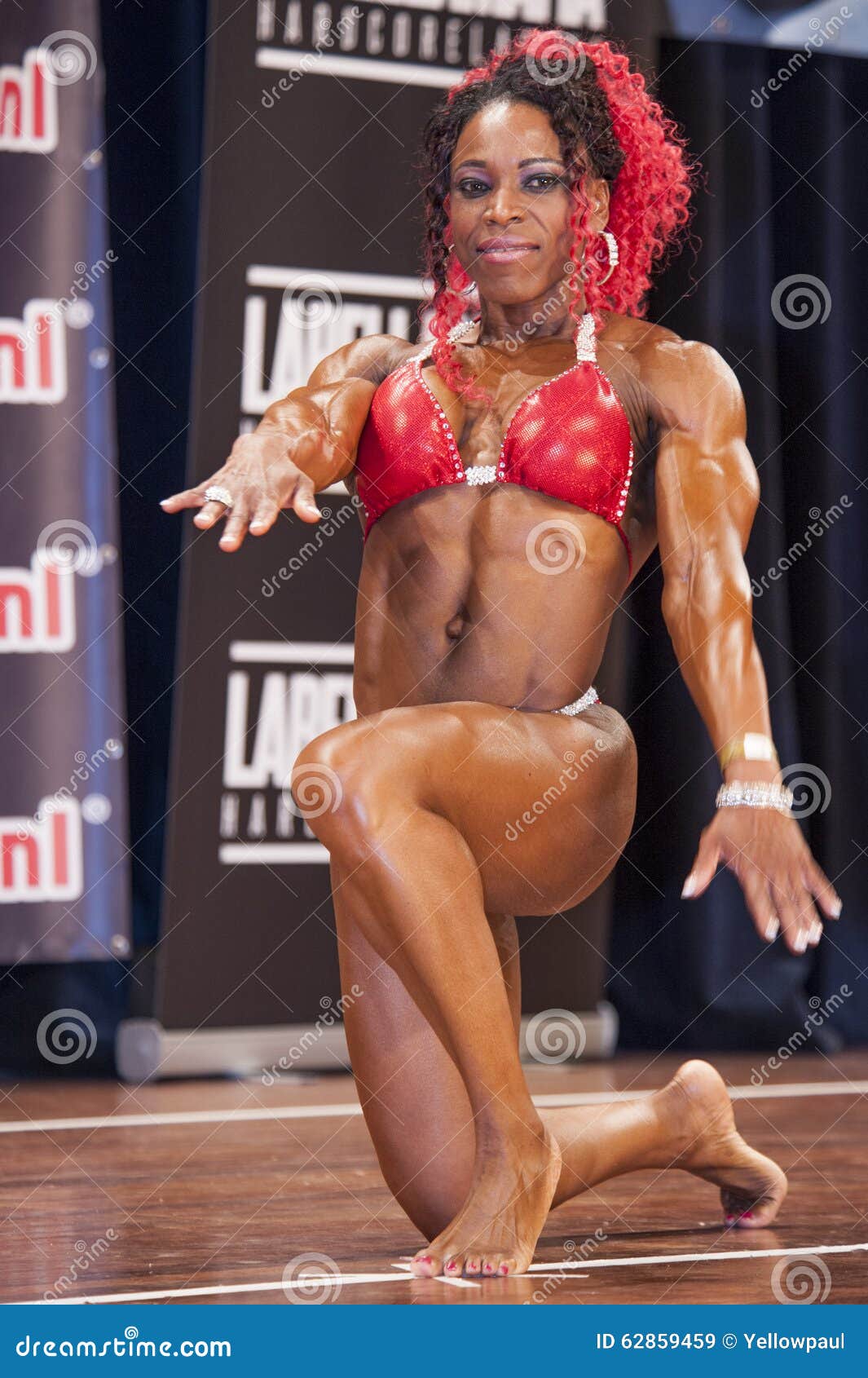 Female Bodybuilder in Triceps Pose in Stage in Bikini Editorial Stock Photo  - Image of championship, active: 59455038