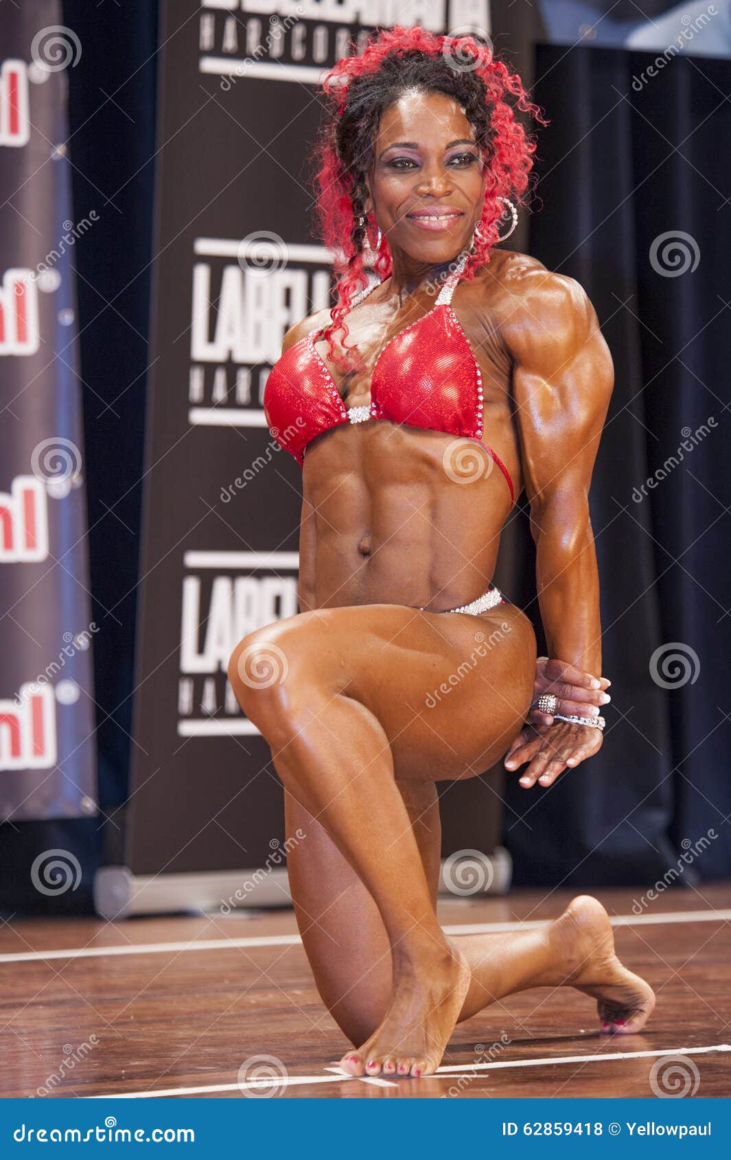 Female Bodybuilder in Red Bikini Shows Her Big Triceps Editorial Stock  Photo - Image of bikini, athletic: 62859418