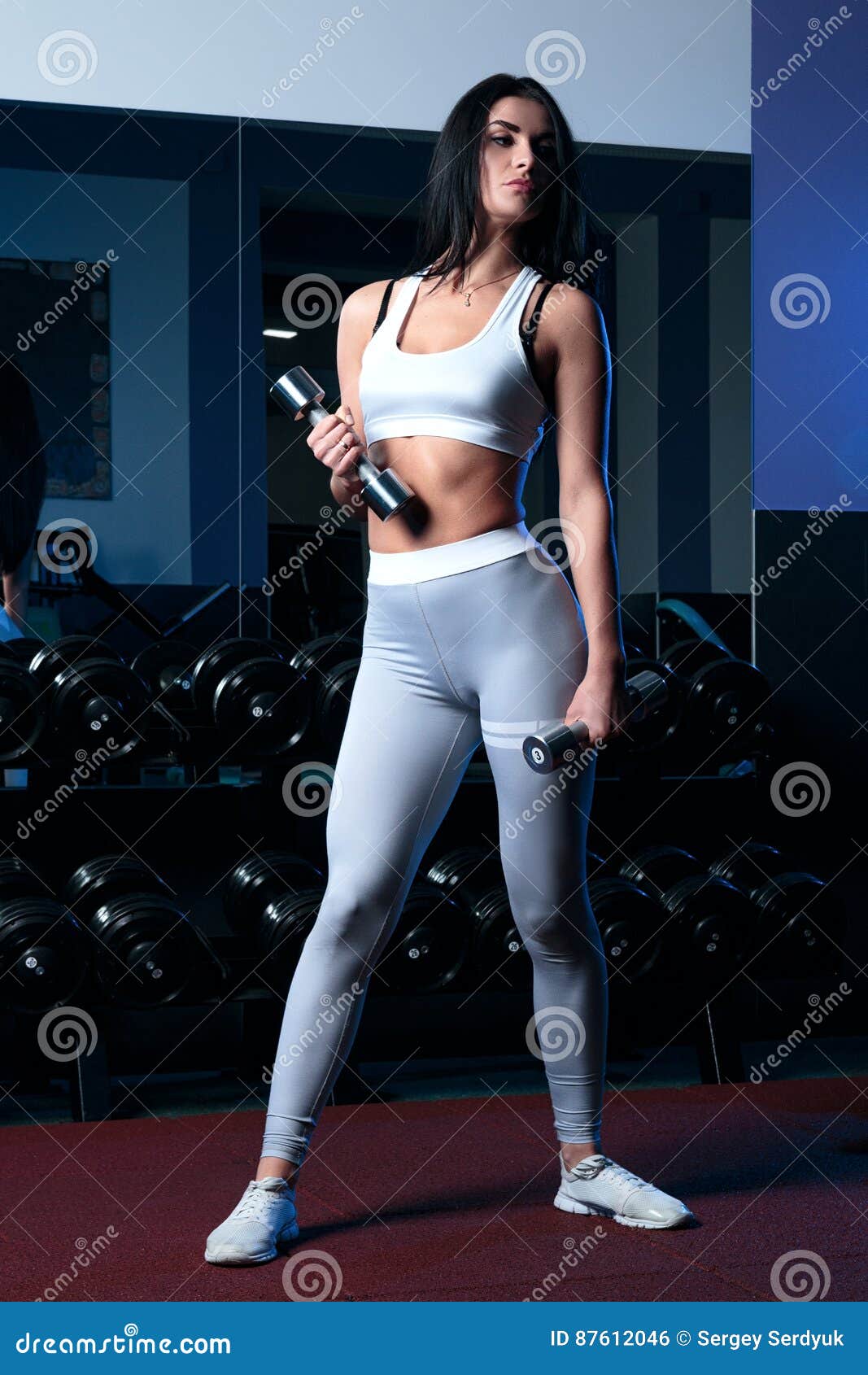 female brunette sexy leggings short t shirt posing sport standing gym 87612046