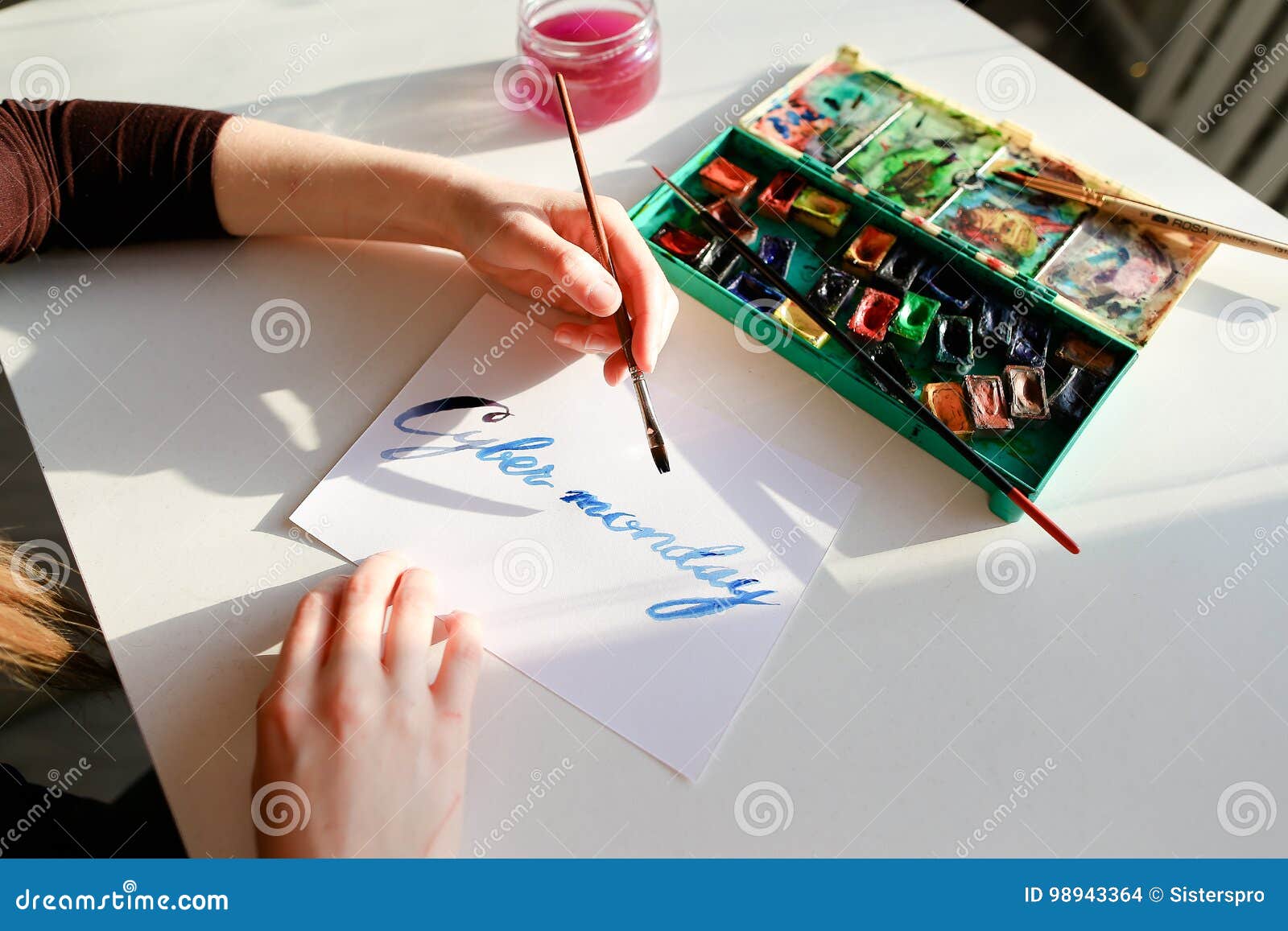 Female Calligrapher Creates Inscription for Sale, Using Brushes Stock ...