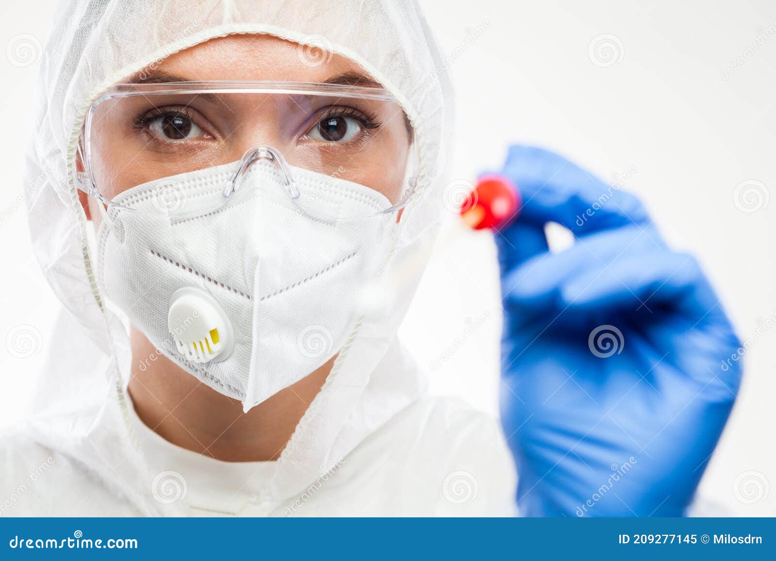 female caucasian nhs front line medic holding swab collection stick