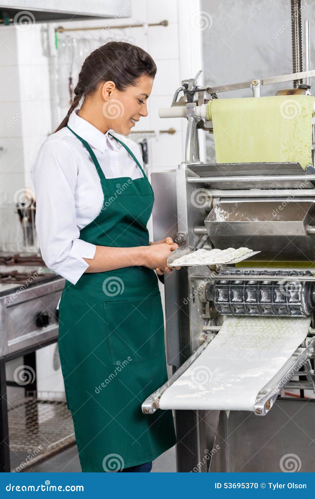 Female Chef Processing Ravioli Pasta in Machine Stock Photo - Image of