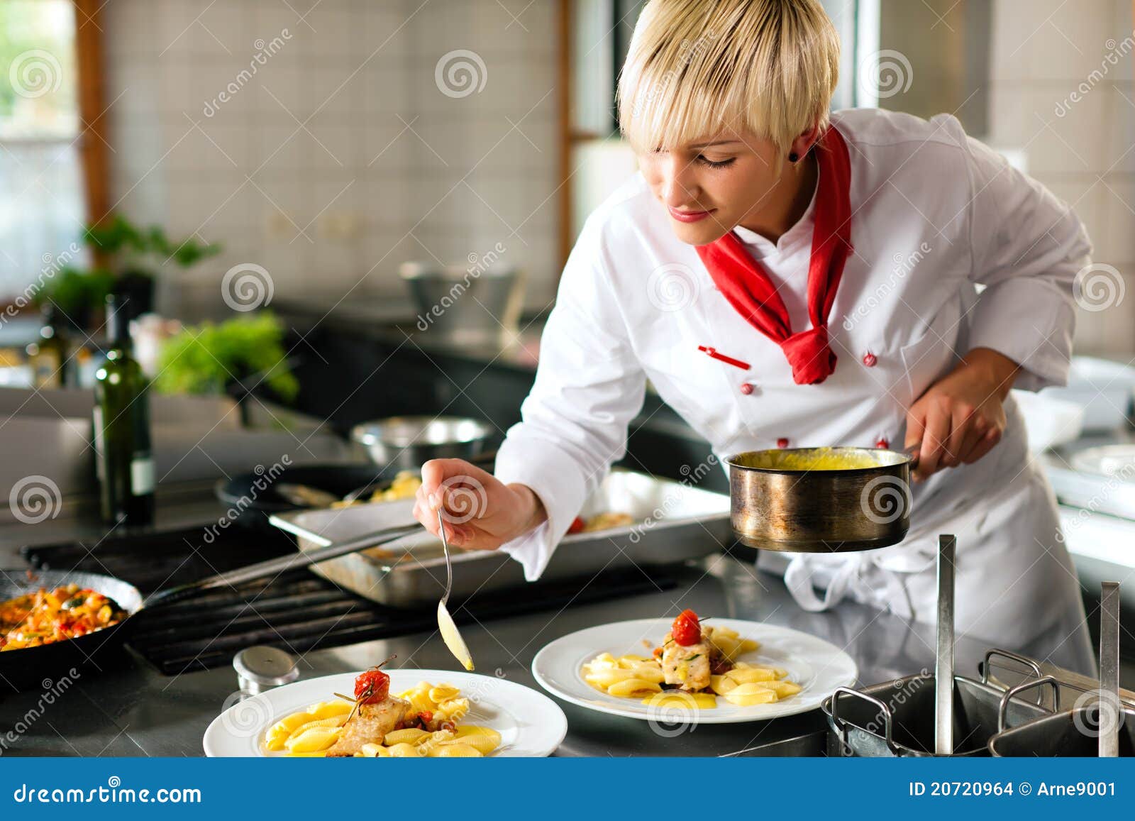 female chef in a restaurant or hotel kitchen cooki