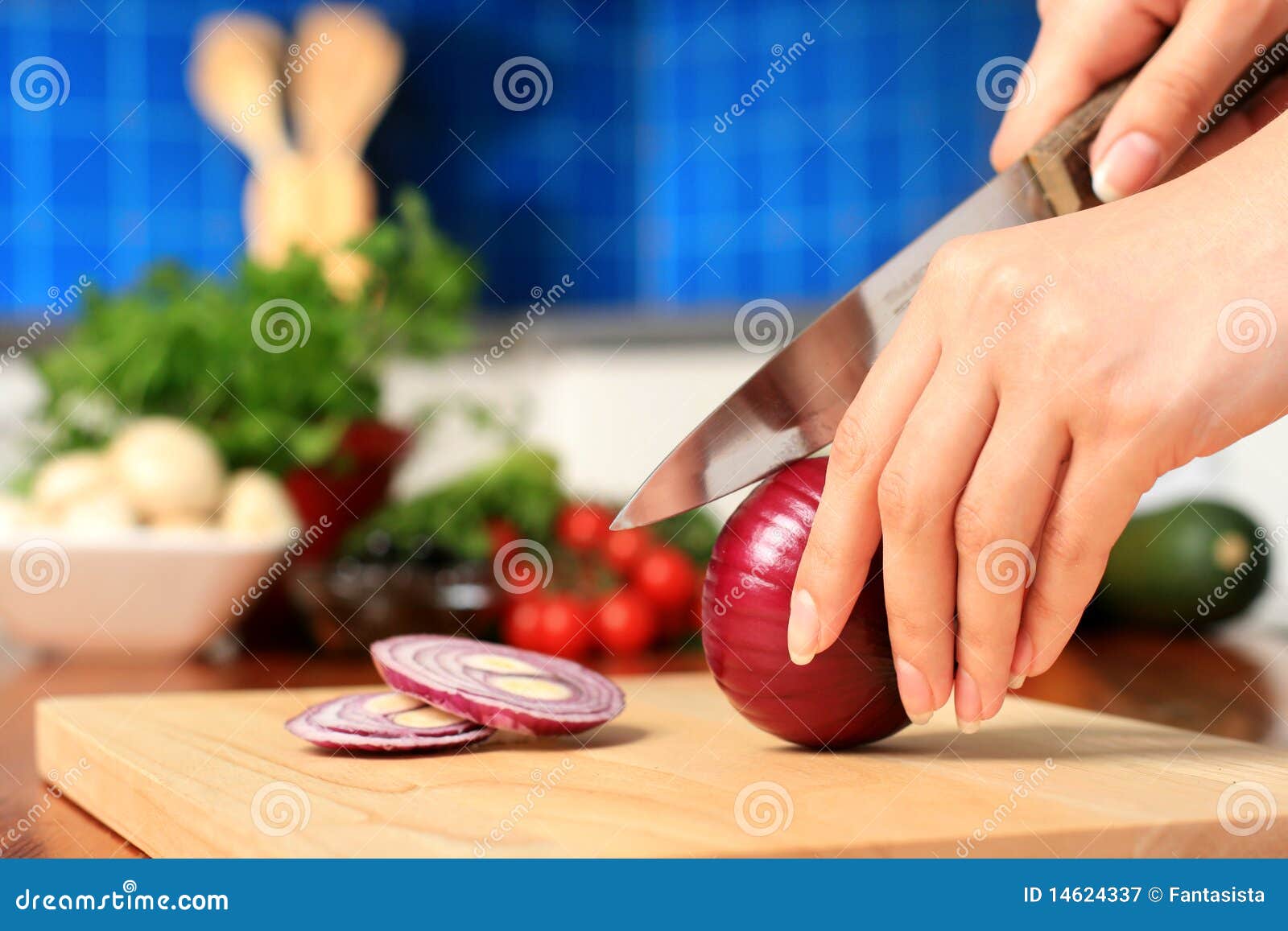 female chopping food ingredients.