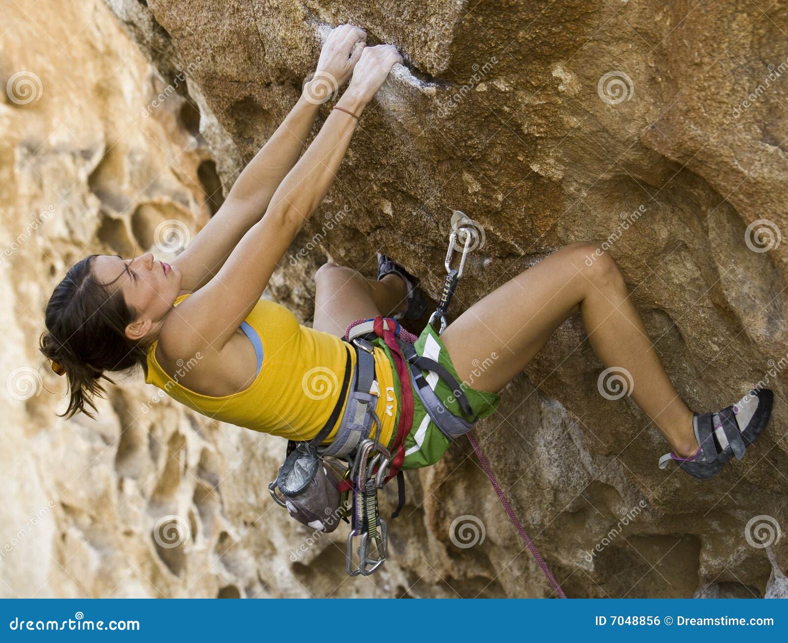 Female Climber Clinging To a Cliff. Stock Photo Image of athletic