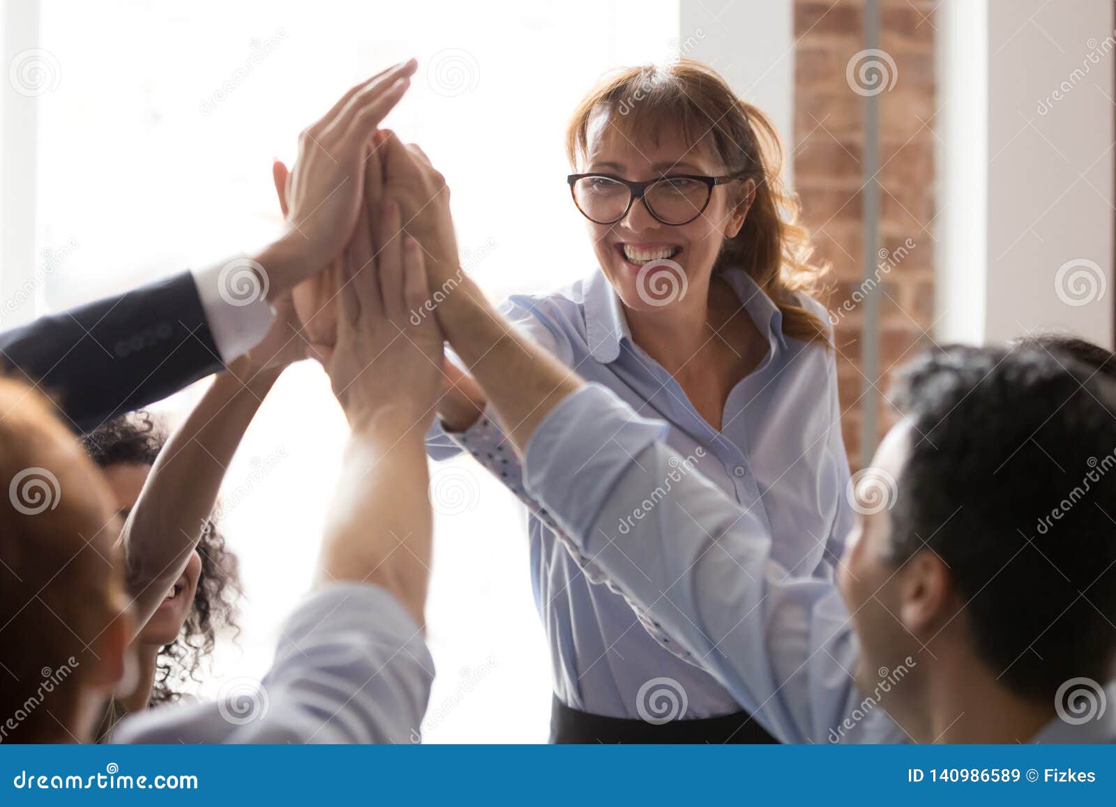 Female Teacher Give High Five To Employees Students Group Stock Image - Image cooperation, result: 140986589