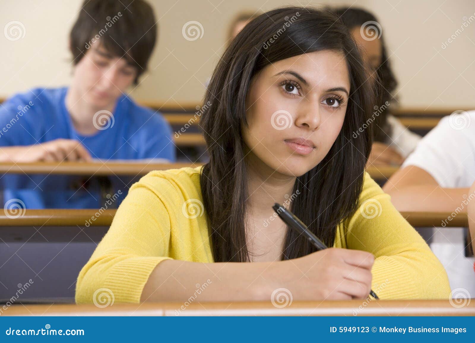 female college student listening to lecture 5949123