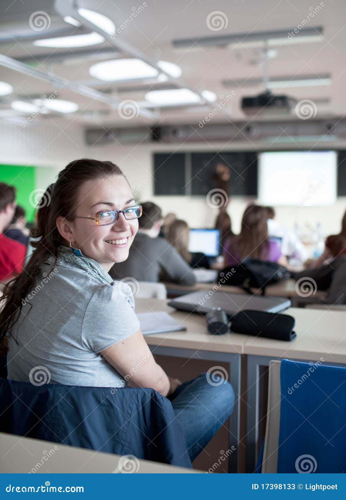 Female College Student Sitting In A Classroom Stock Image - Image of