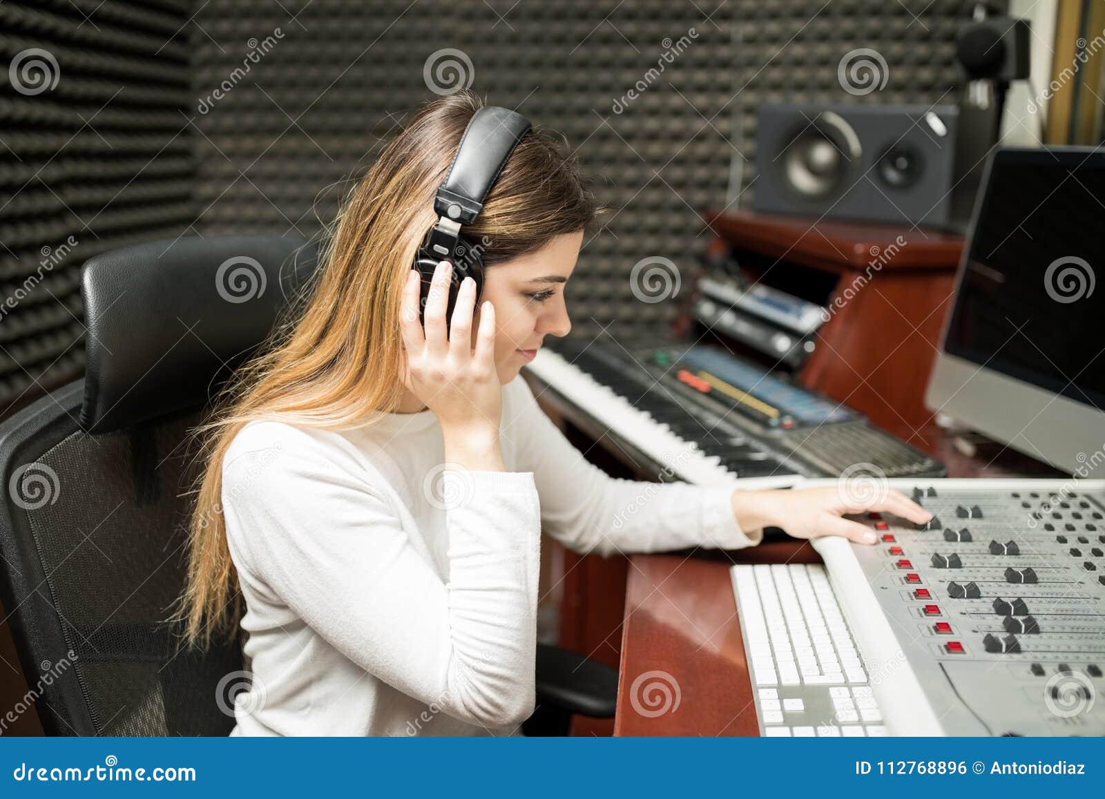 female composer listening her new track