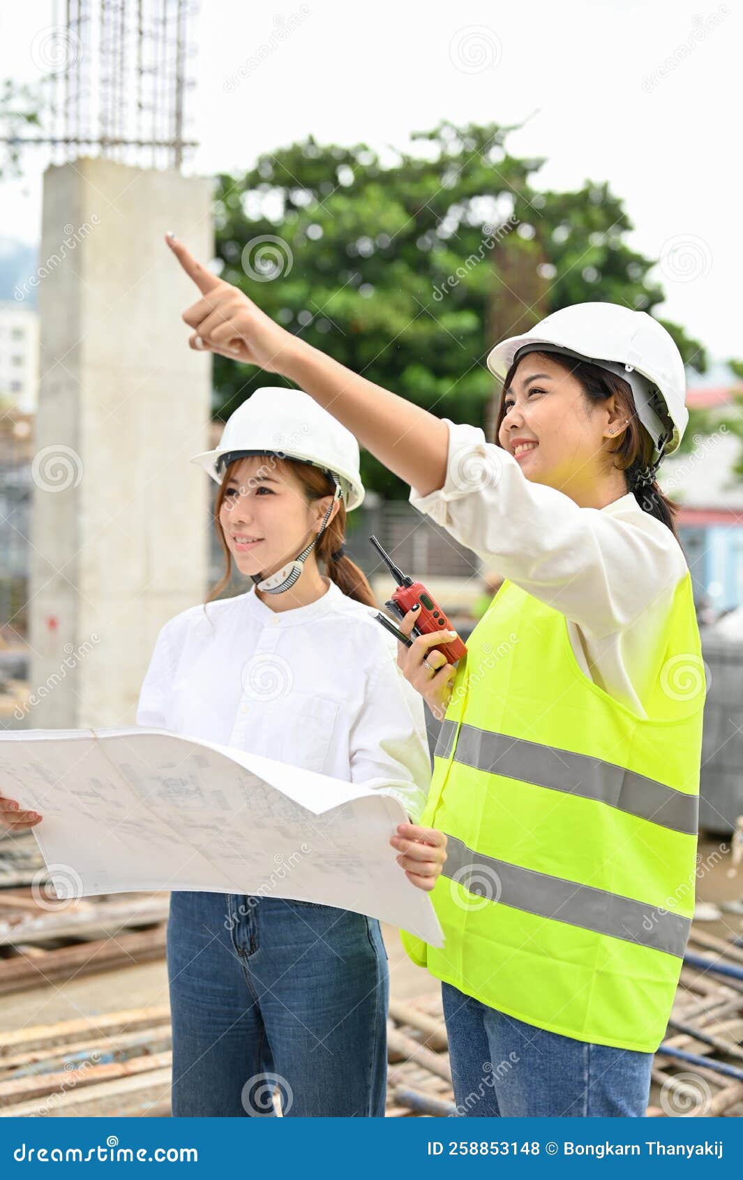 Female Construction Inspector Explaining the Plan To a Female Architect