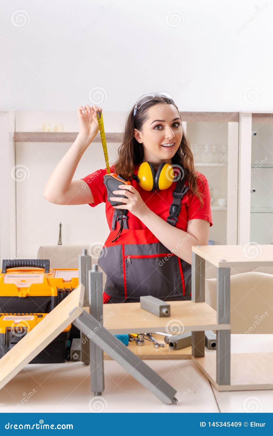 The Female Contractor Repairing Furniture at Home Stock Image - Image ...