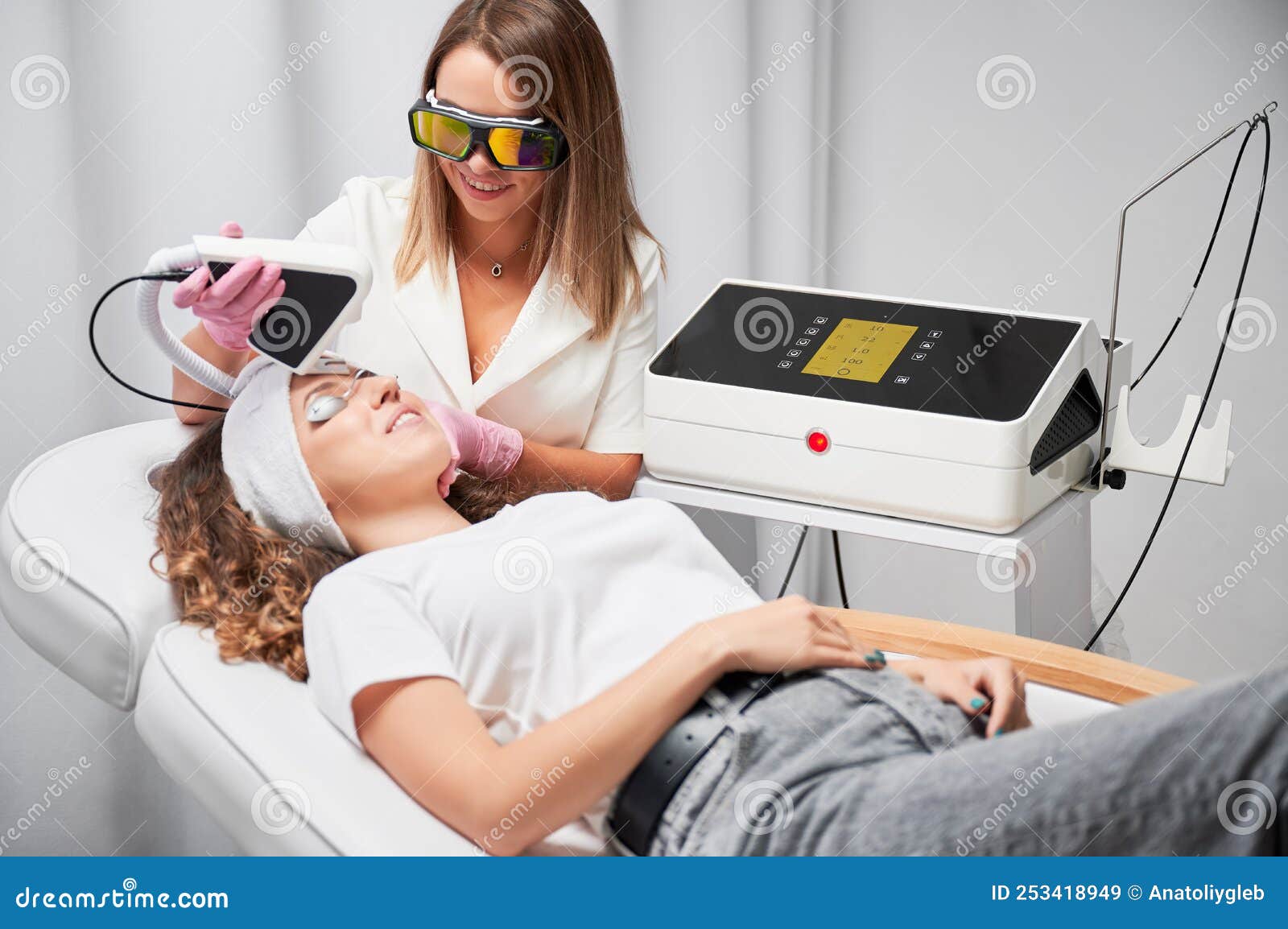 Young Woman Receiving Laser Facial Treatment In Cosmetology Clinic Stock Image Image Of