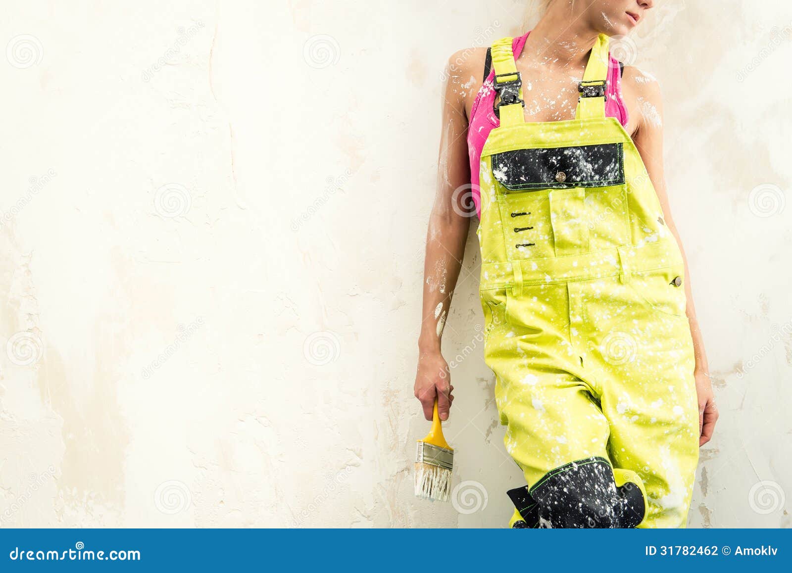 female in coverall indoors