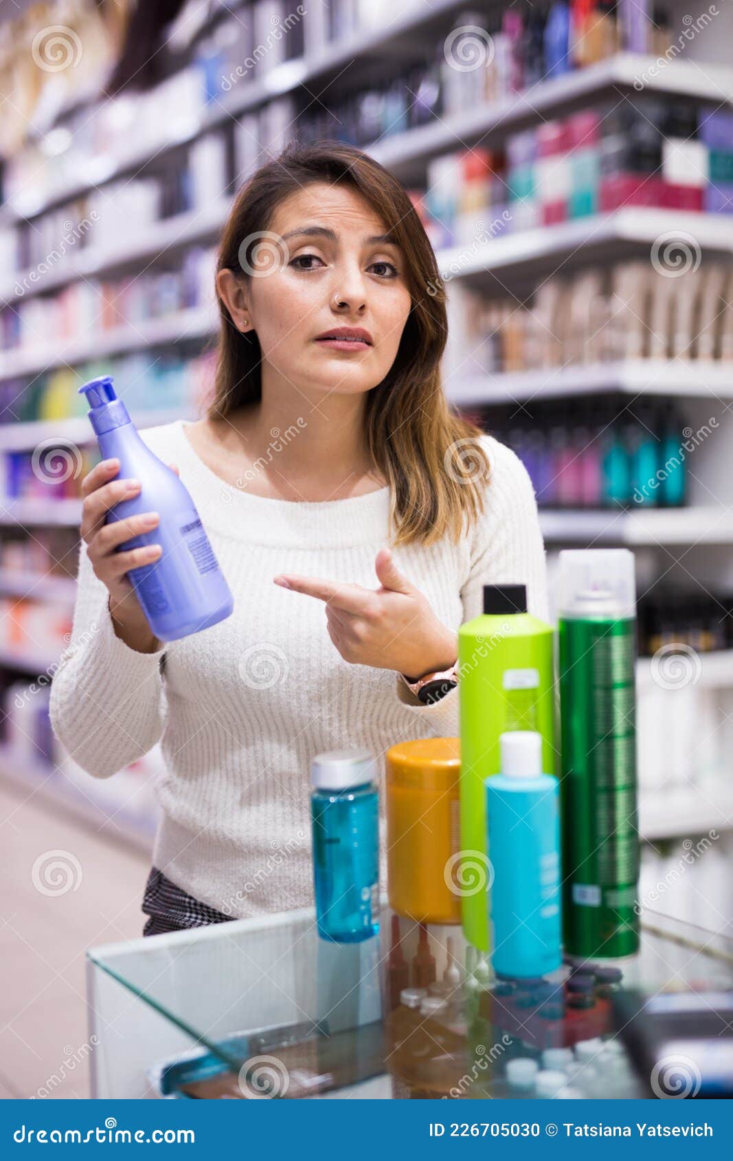Female Customer Asking About Hair Care Product In Store ...