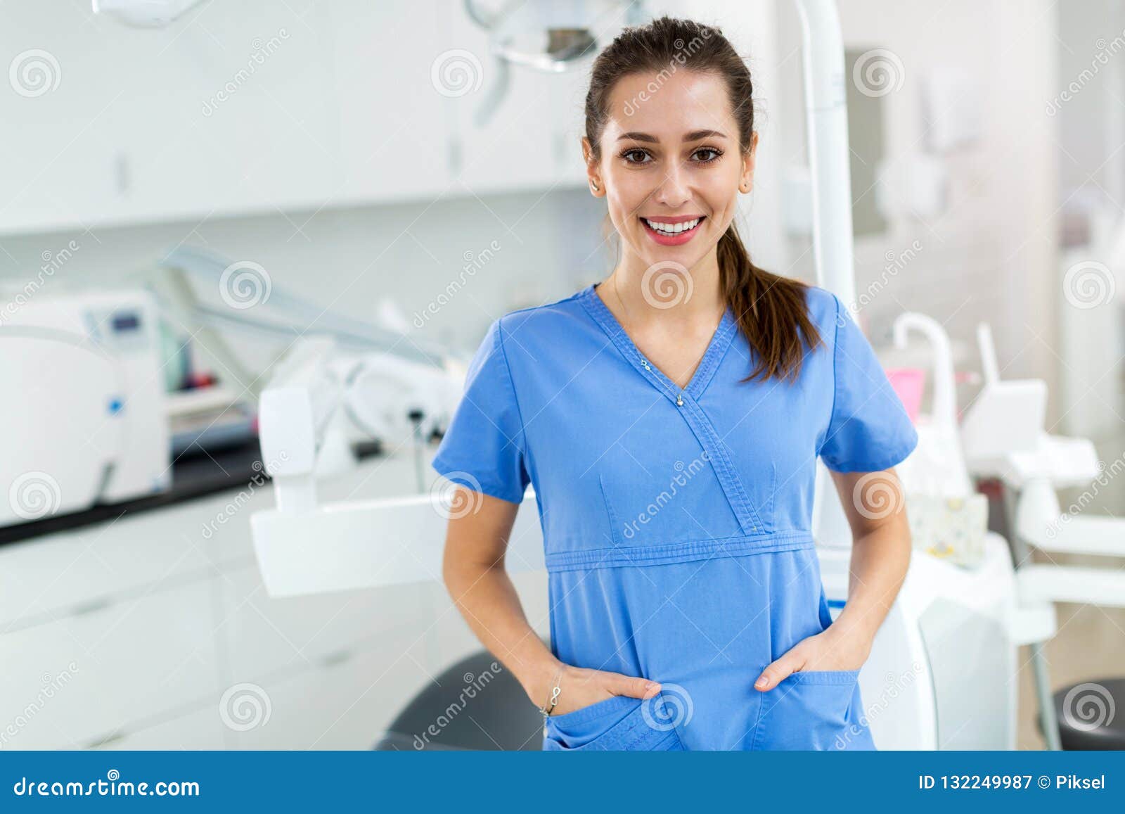 female dental assistant in office