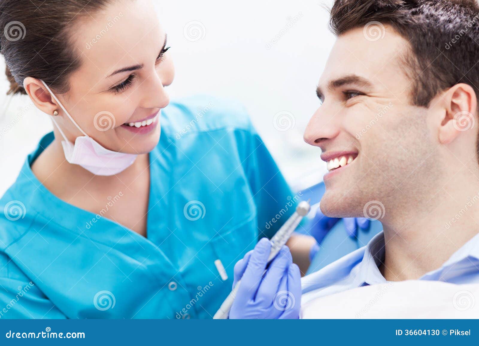 female dentist with male patient