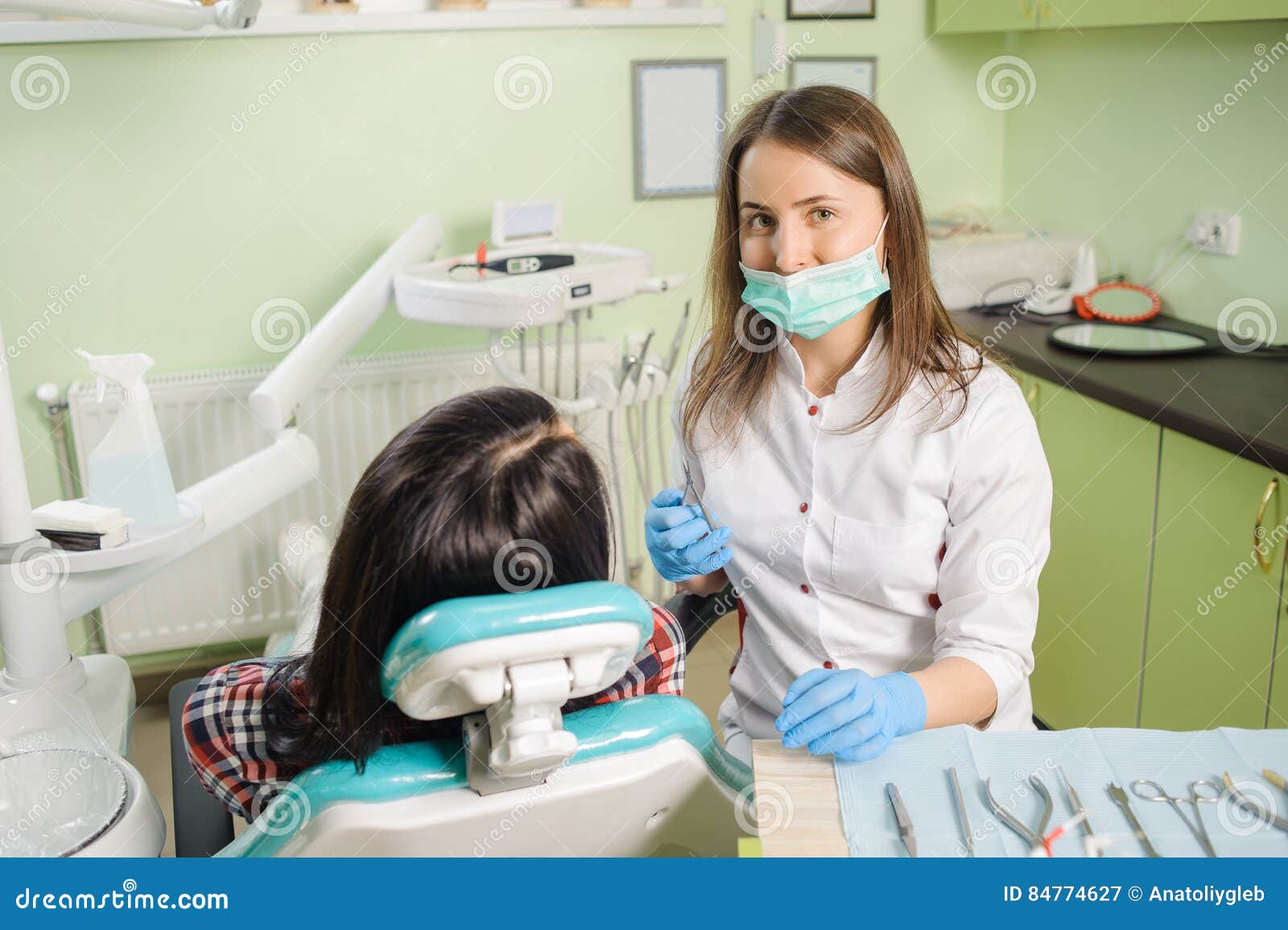 Female Dentist Working At Dental Clinic With Female Patien