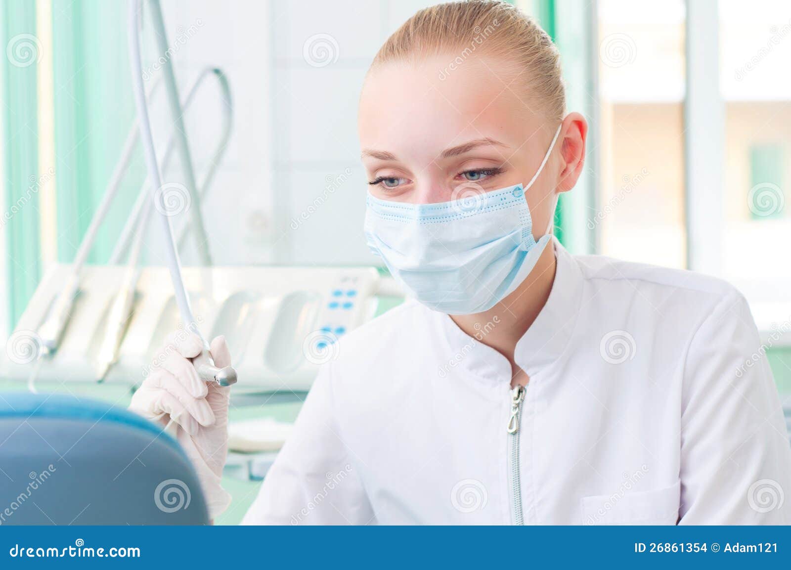 Female Dentists in Protective Mask Holds a Dental Stock Photo Image