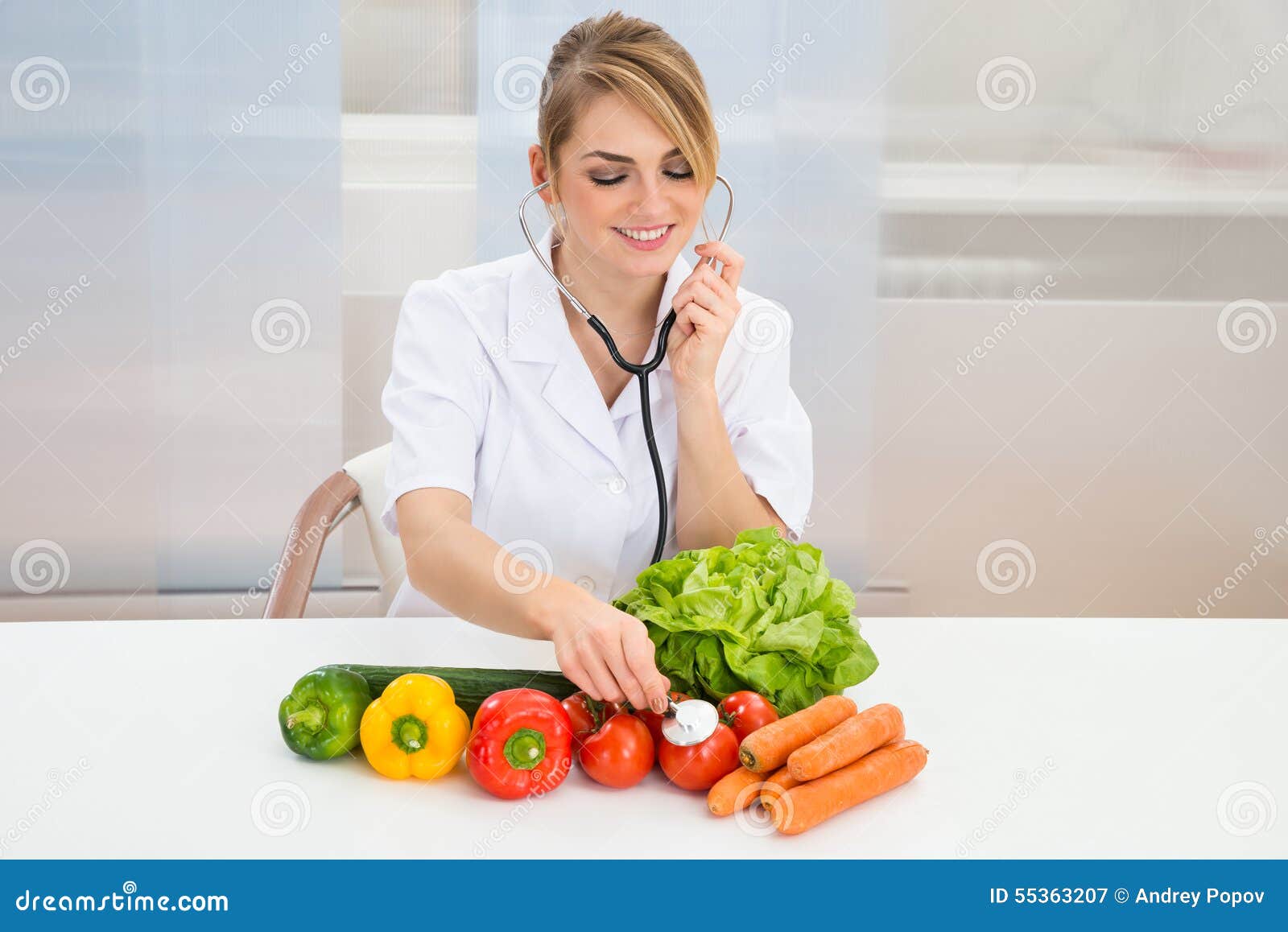 female dietician examining vegetables