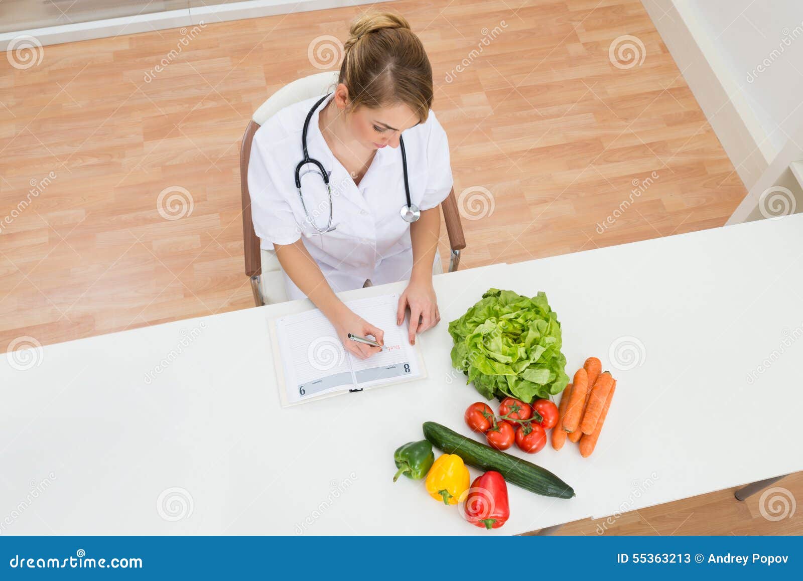 female dietician writing in diary