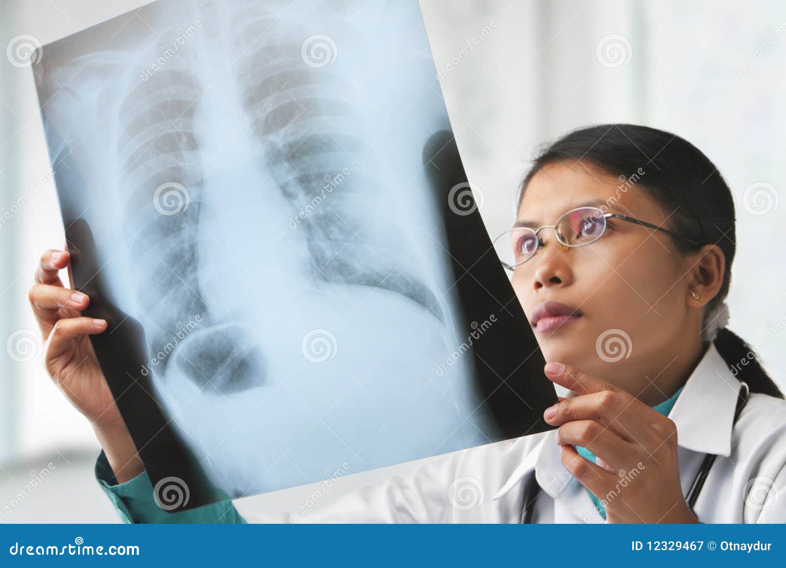 female doctor checking xray image